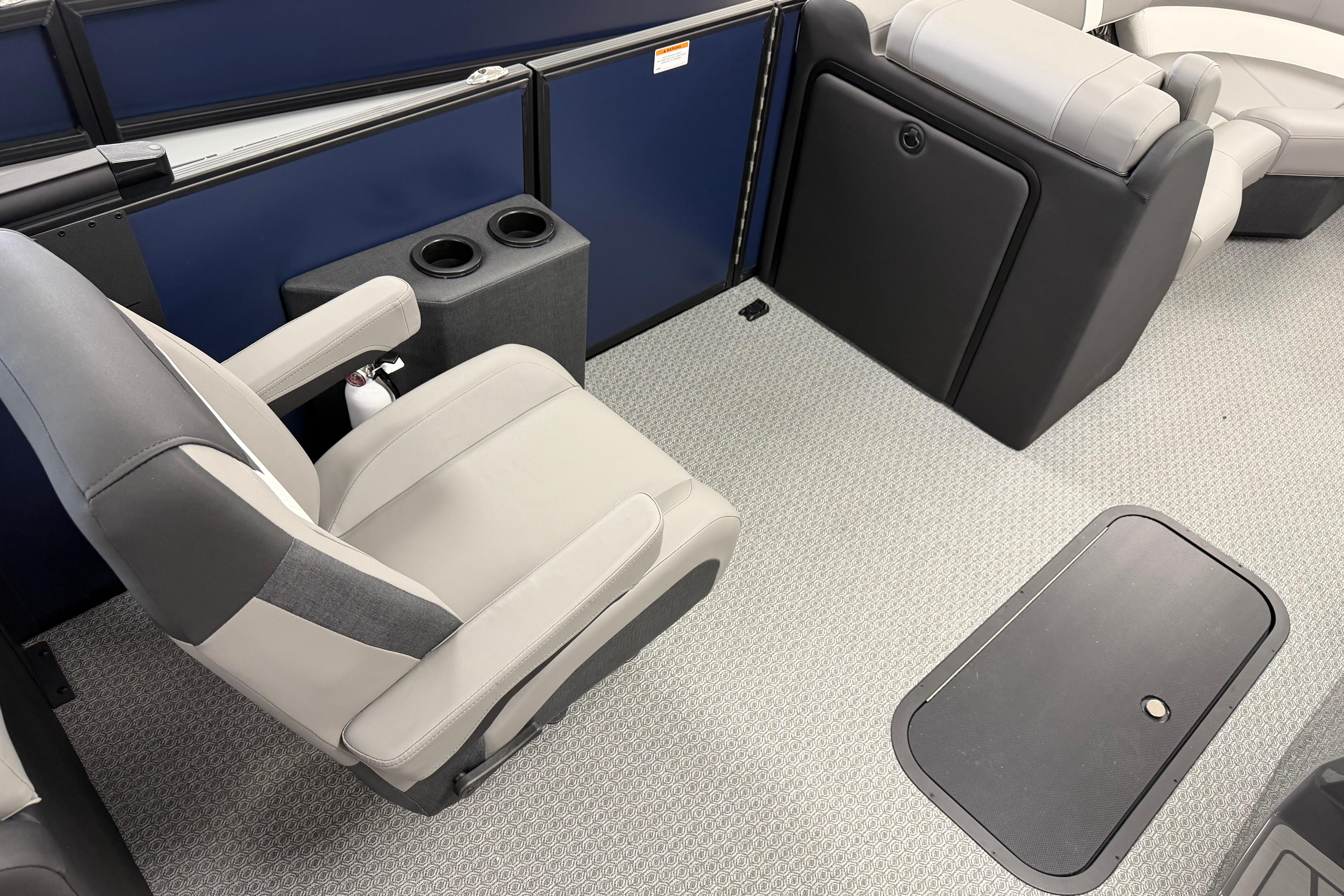 Interior of 2026 Evotti 523QL boat with gray seating and cup holders.
