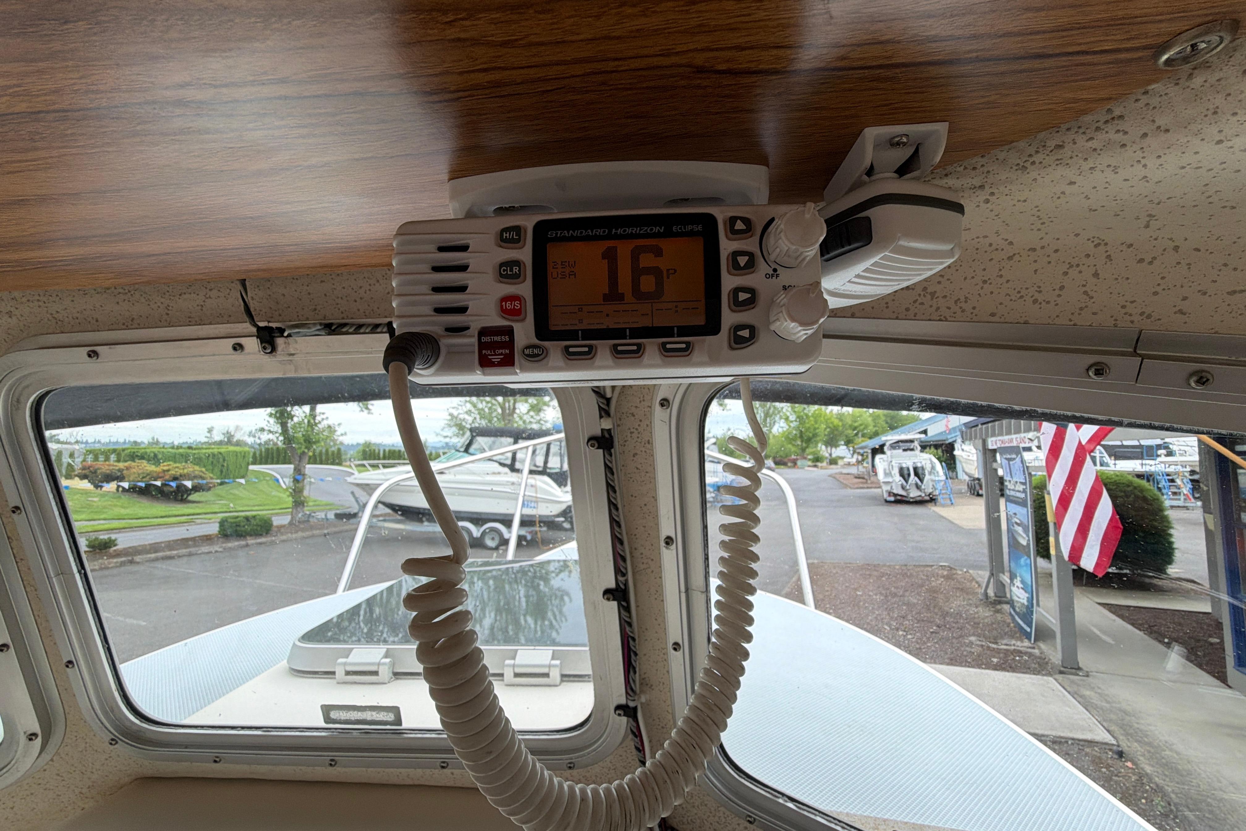 Interior view of a 1989 C-Dory 22' Angler boat with a mounted radio.