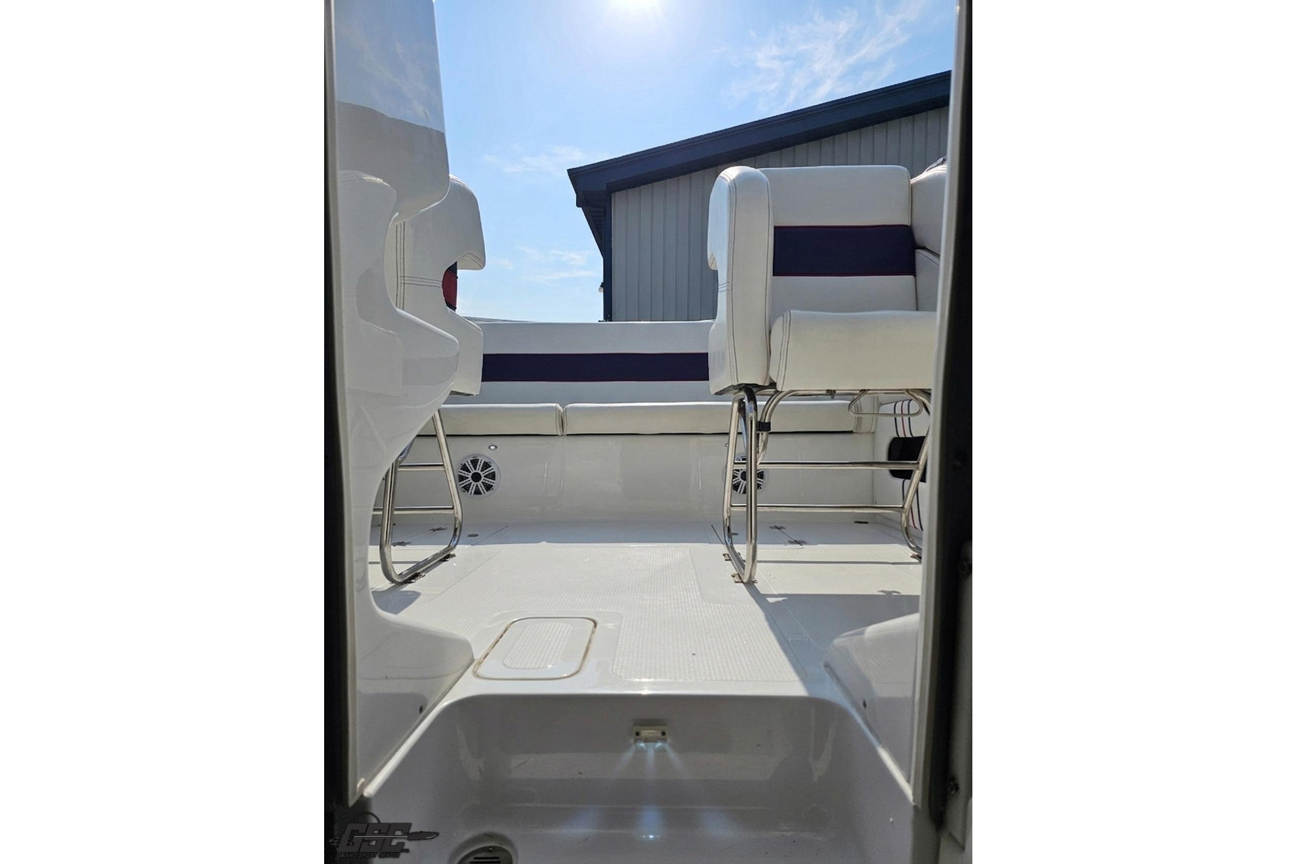 2019 Advantage 25 Citation Bowrider interior with white seating and sunny sky.