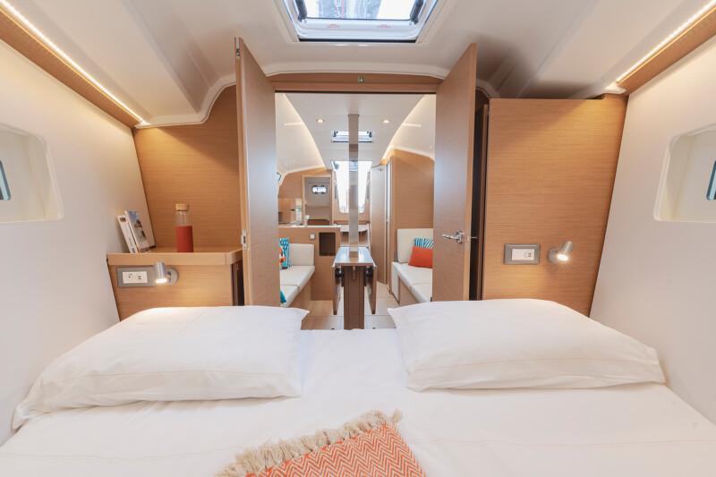 Interior of 2025 Jeanneau Sun Odyssey 350 yacht, featuring cozy cabin and modern design.