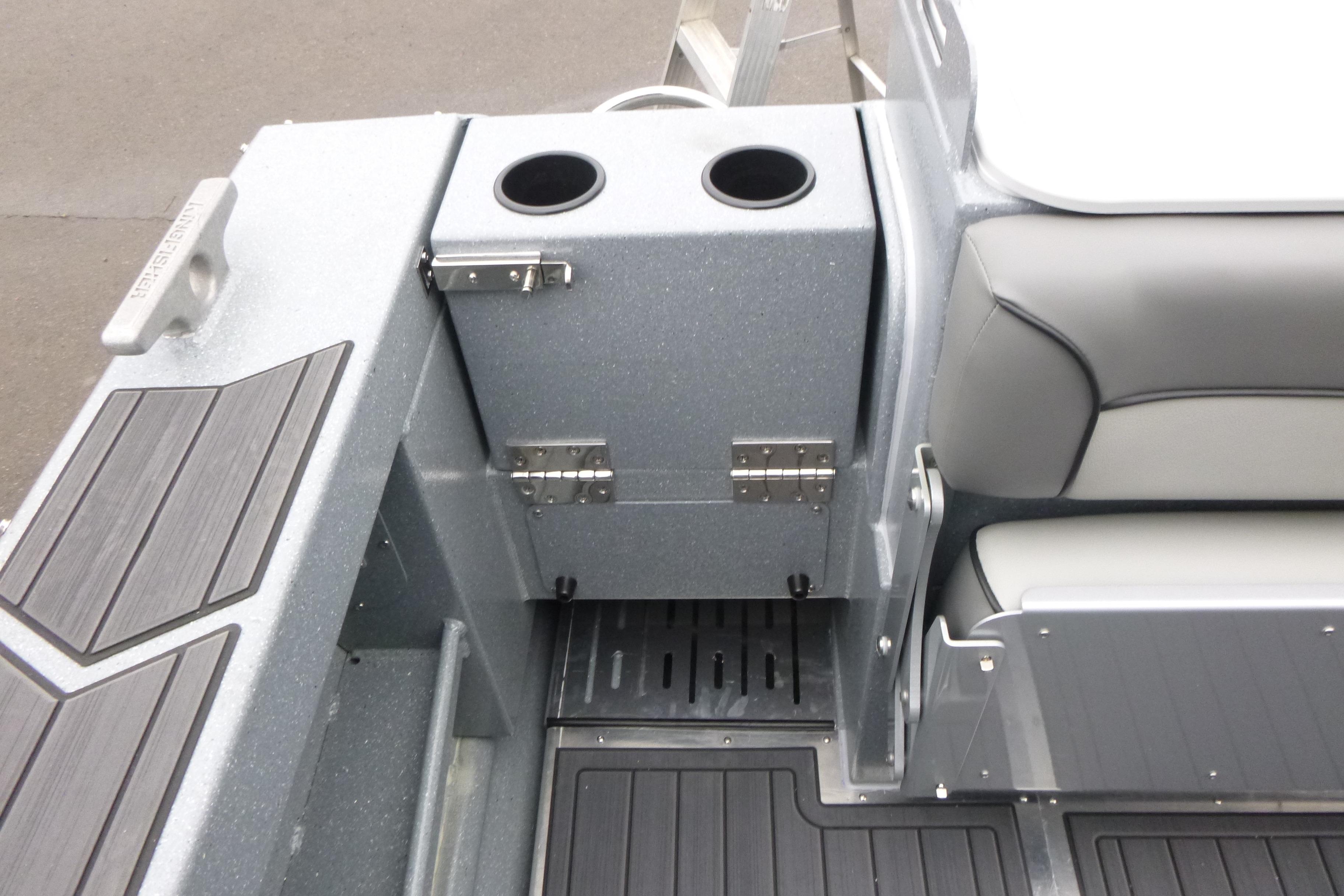Interior of 2026 KingFisher 25 XAC boat with seating and cup holders.