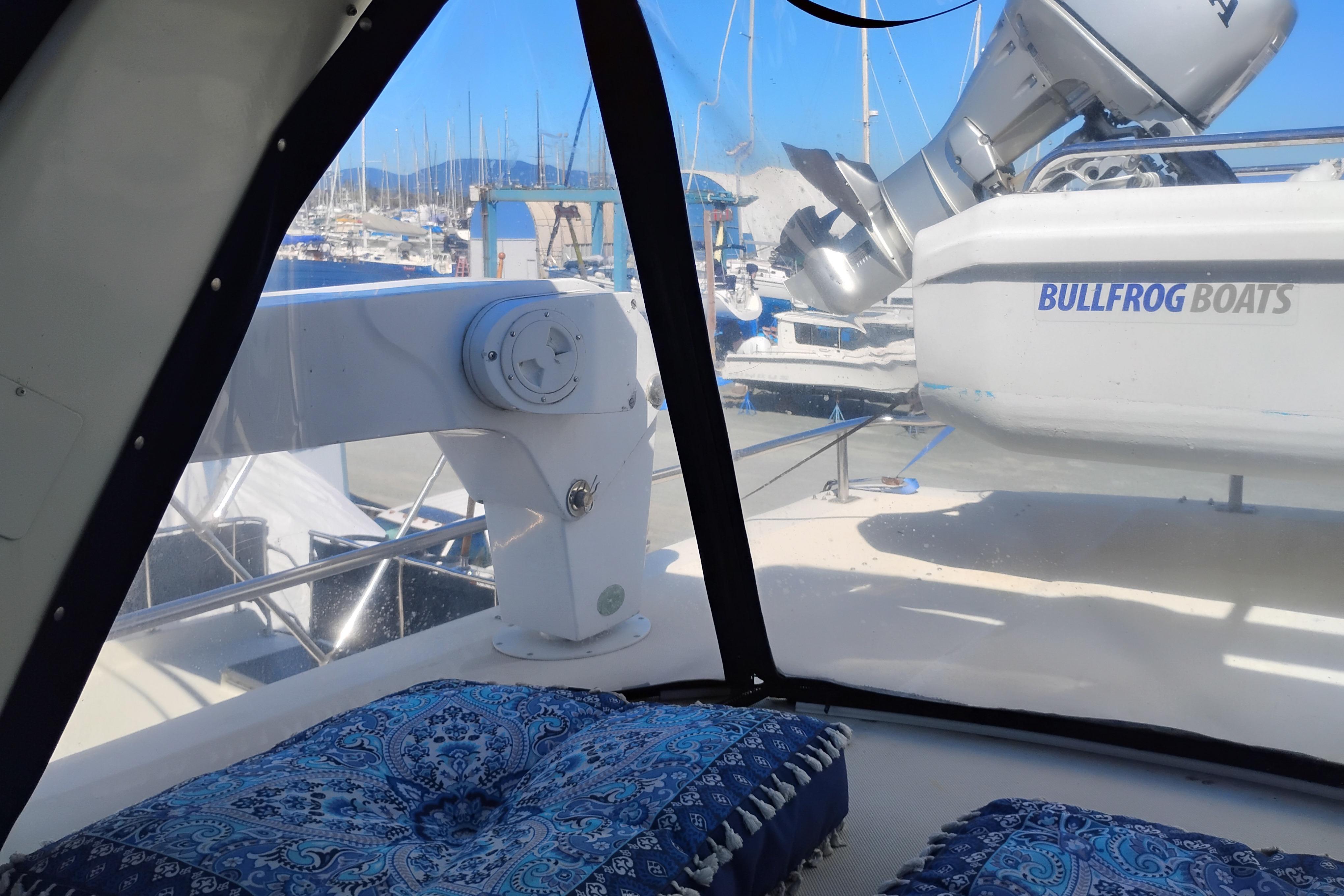 1988 PT 52 AFT Cabin Motor Yacht interior with marina view and Bullfrog Boats equipment.