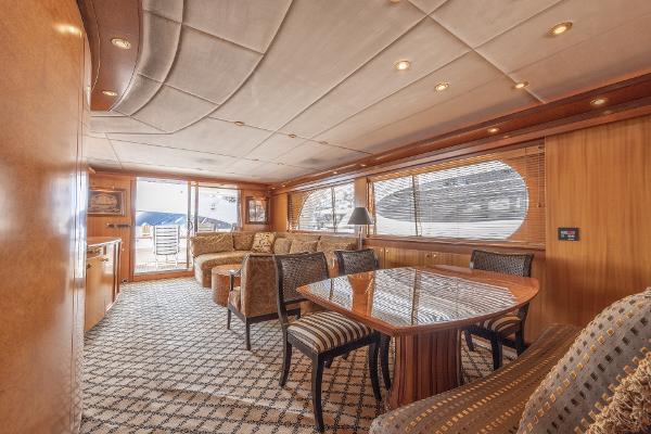 Luxurious interior of 2001 Grand Harbour 76 yacht with elegant dining and seating area.