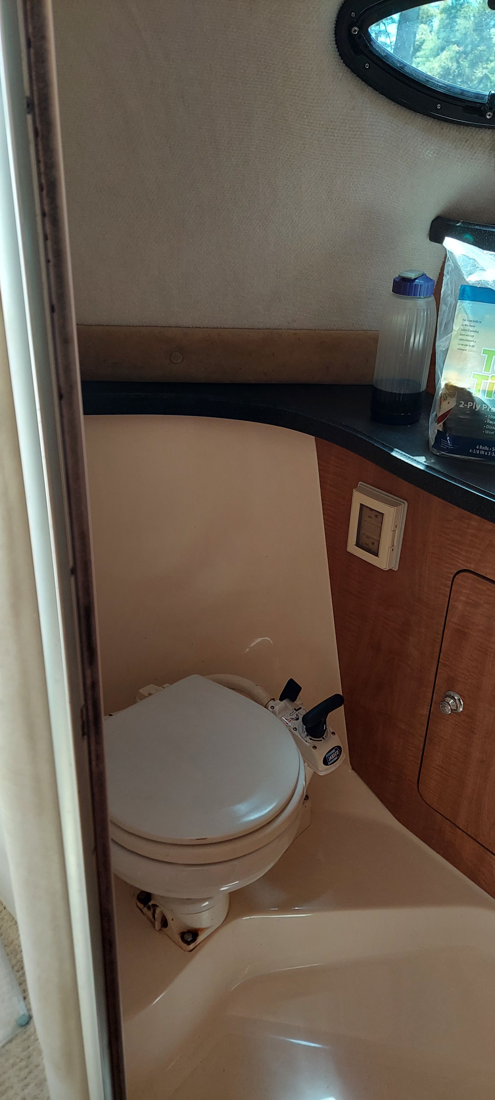 Bathroom in 2004 Regal Commodore 2465 boat.