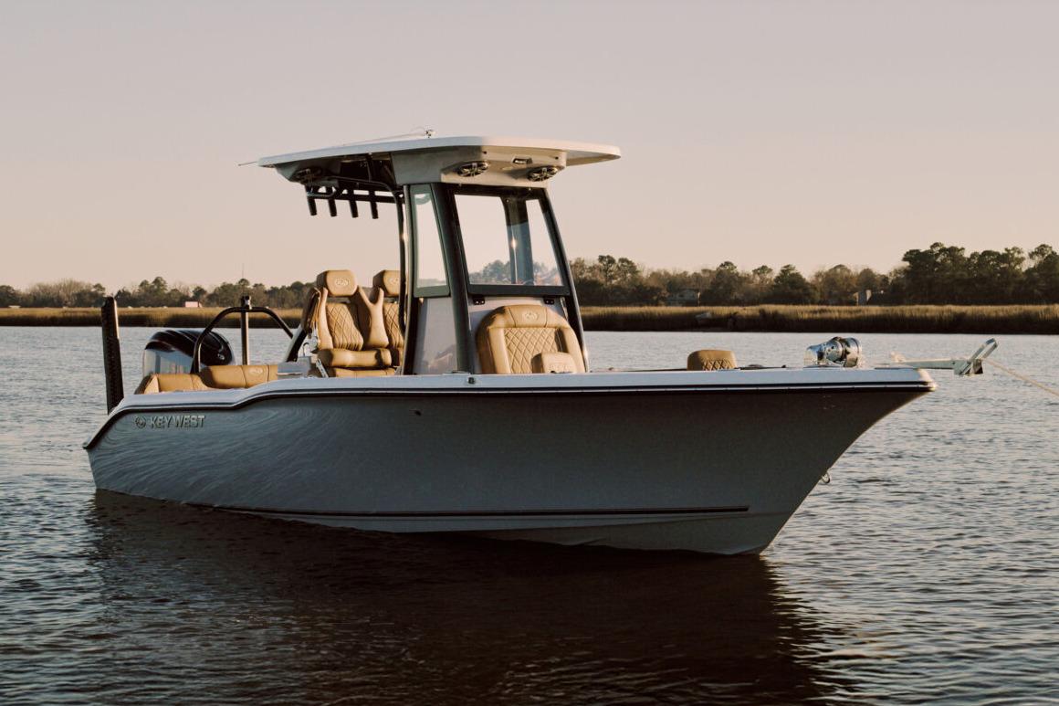 Manufacturer Provided Image: 2025 Key West 239 FSR boat on calm water at sunset.