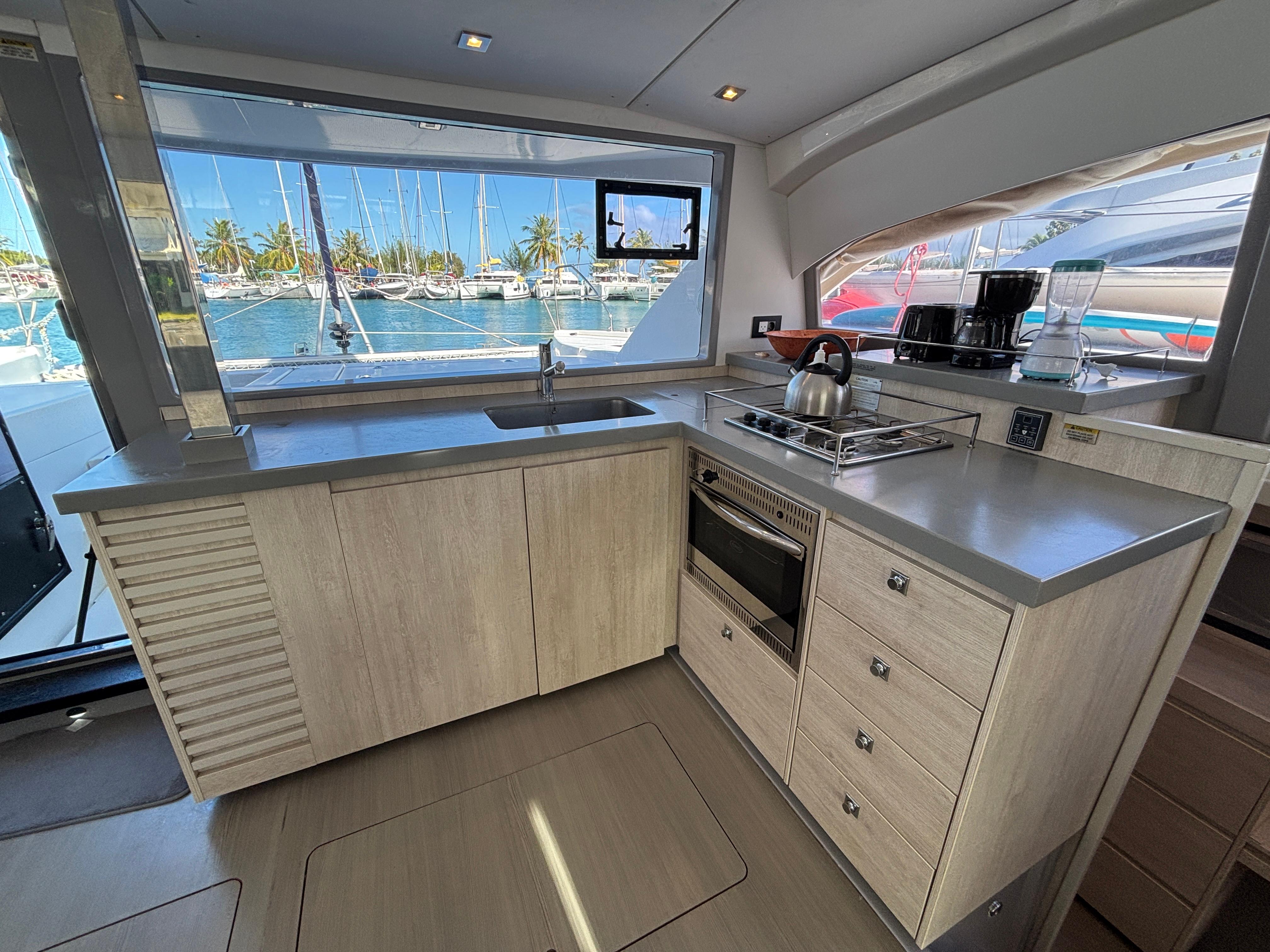 Modern kitchen interior on a 2019 Leopard 40 yacht, featuring sleek countertops and appliances.