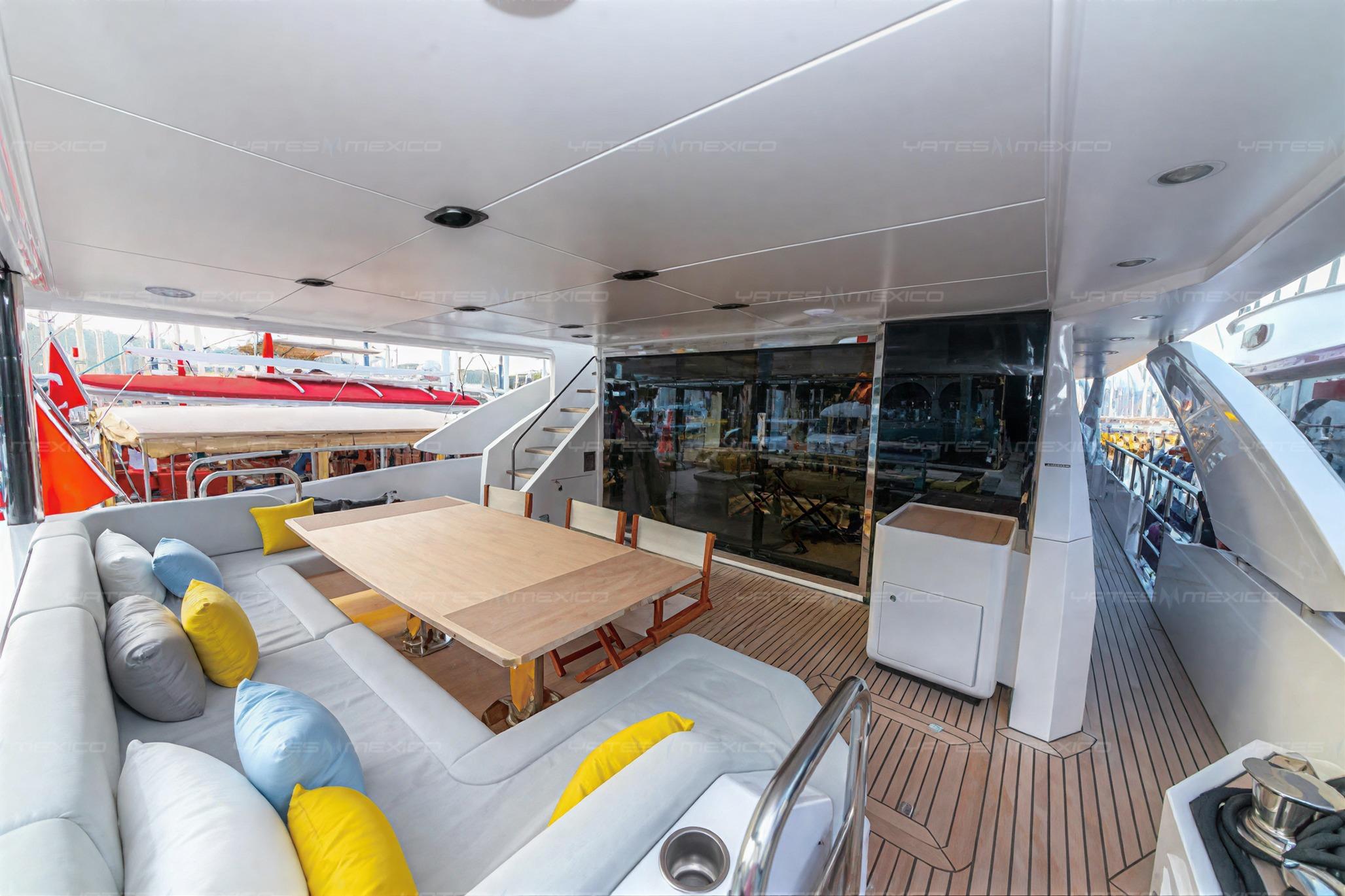 Luxurious 2019 Azimut Grande 27M yacht deck with elegant seating and dining area.