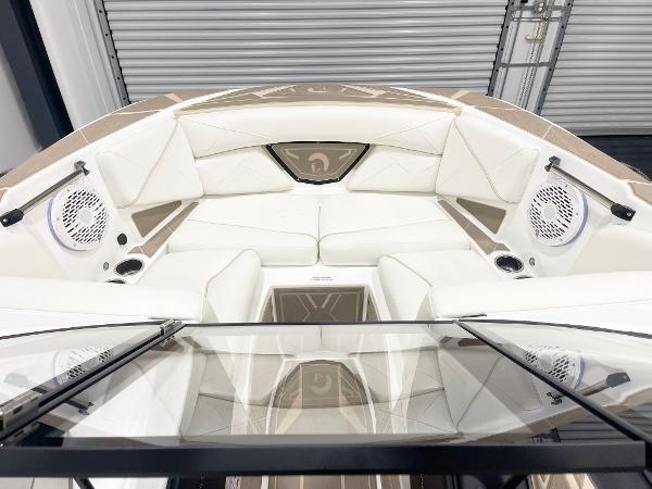 2025 Centurion NV213 boat interior with white seating and built-in speakers.