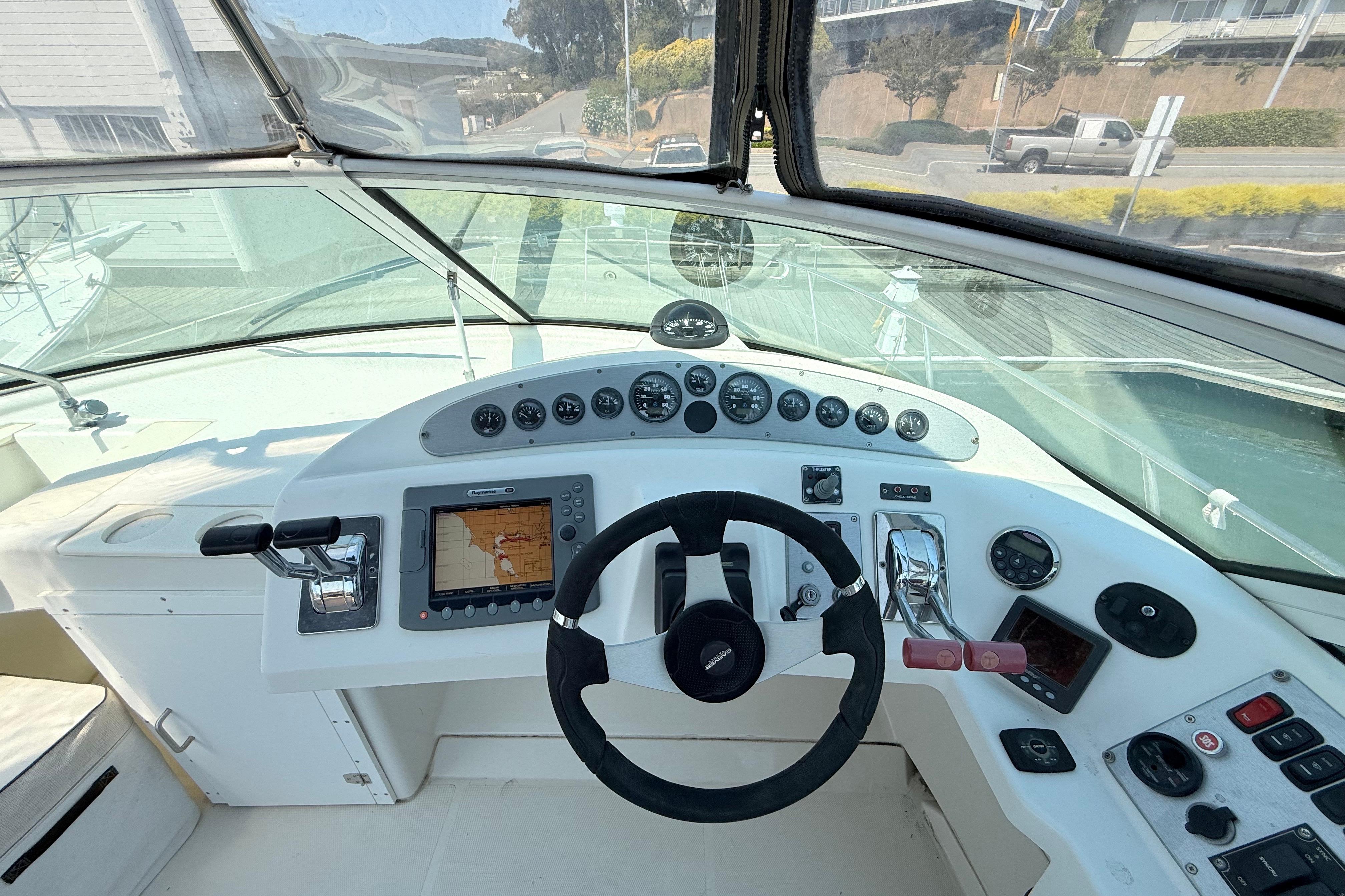 2007 Carver 36 Mariner helm with navigation controls and steering wheel.