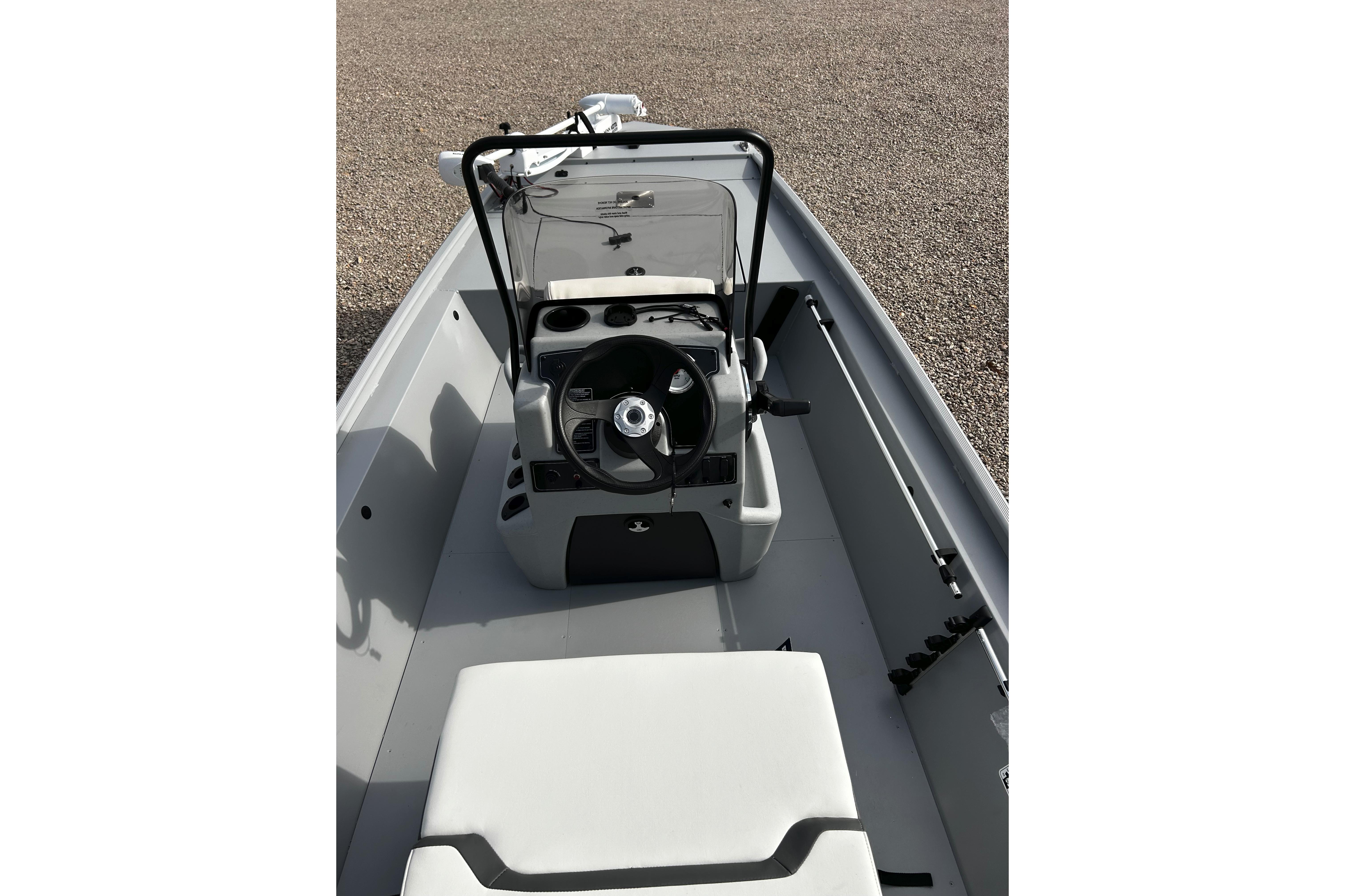 2026 Tracker Bass Tracker Classic CC boat interior with steering console and seating.