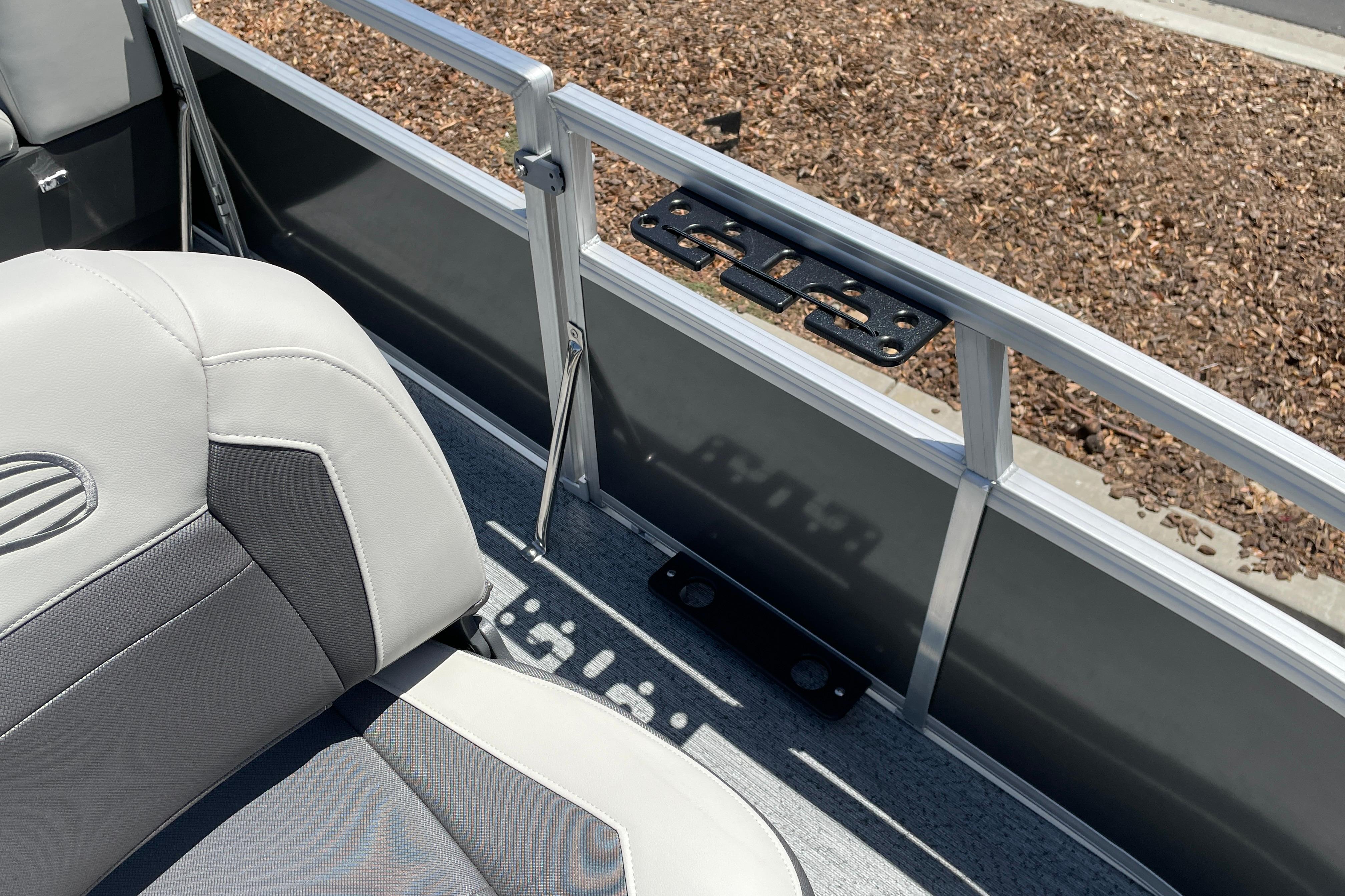 2026 Sun Tracker Bass Buggy 16 XL Select boat interior with gray seating and railing details.