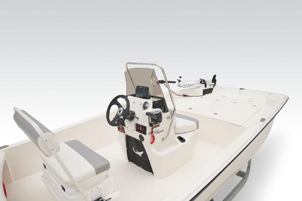 2026 Mako Pro Skiff 17 CC boat interior with steering console and seating.