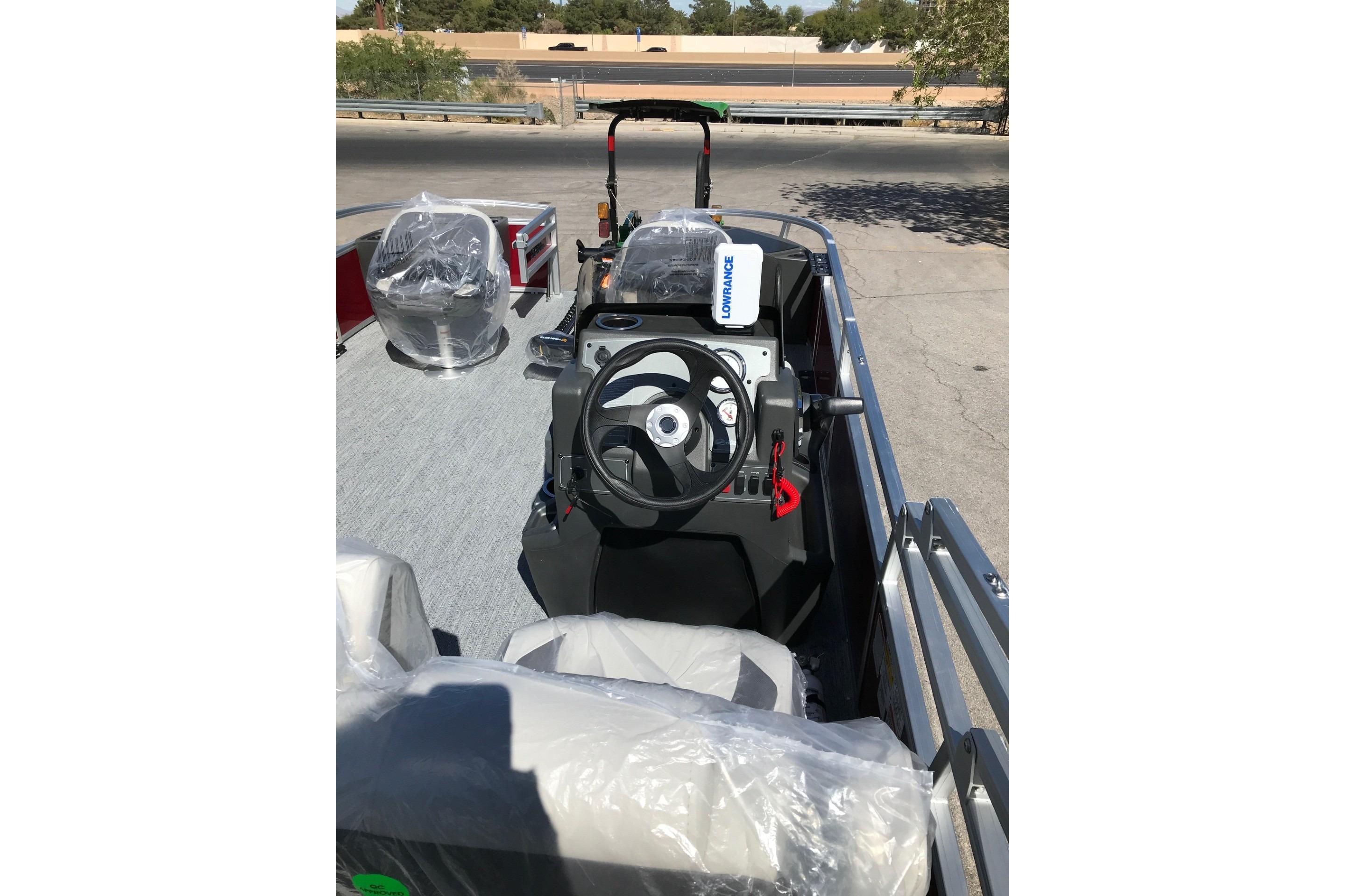 2026 Sun Tracker Bass Buggy 18 DLX pontoon boat interior with steering console.