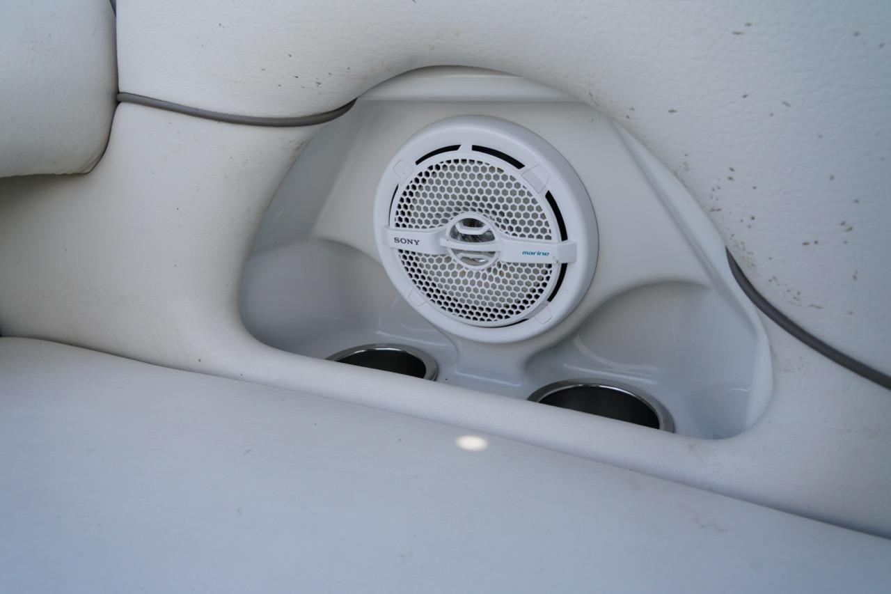 Sony marine speaker and cup holders on 2004 Crownline 216 LS boat interior.