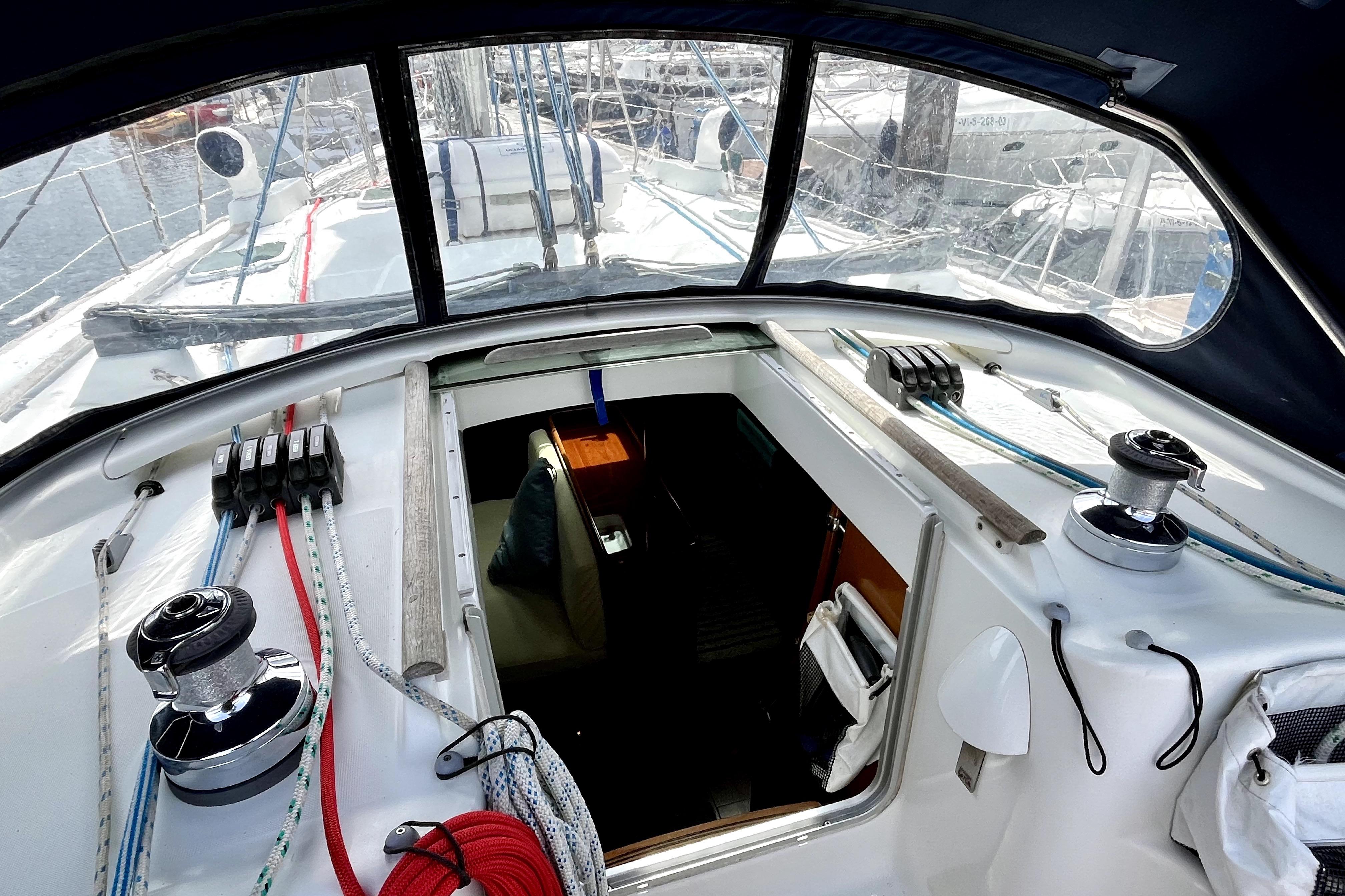 Cockpit view of a 2003 Beneteau 50 sailboat, showcasing winches and rigging.