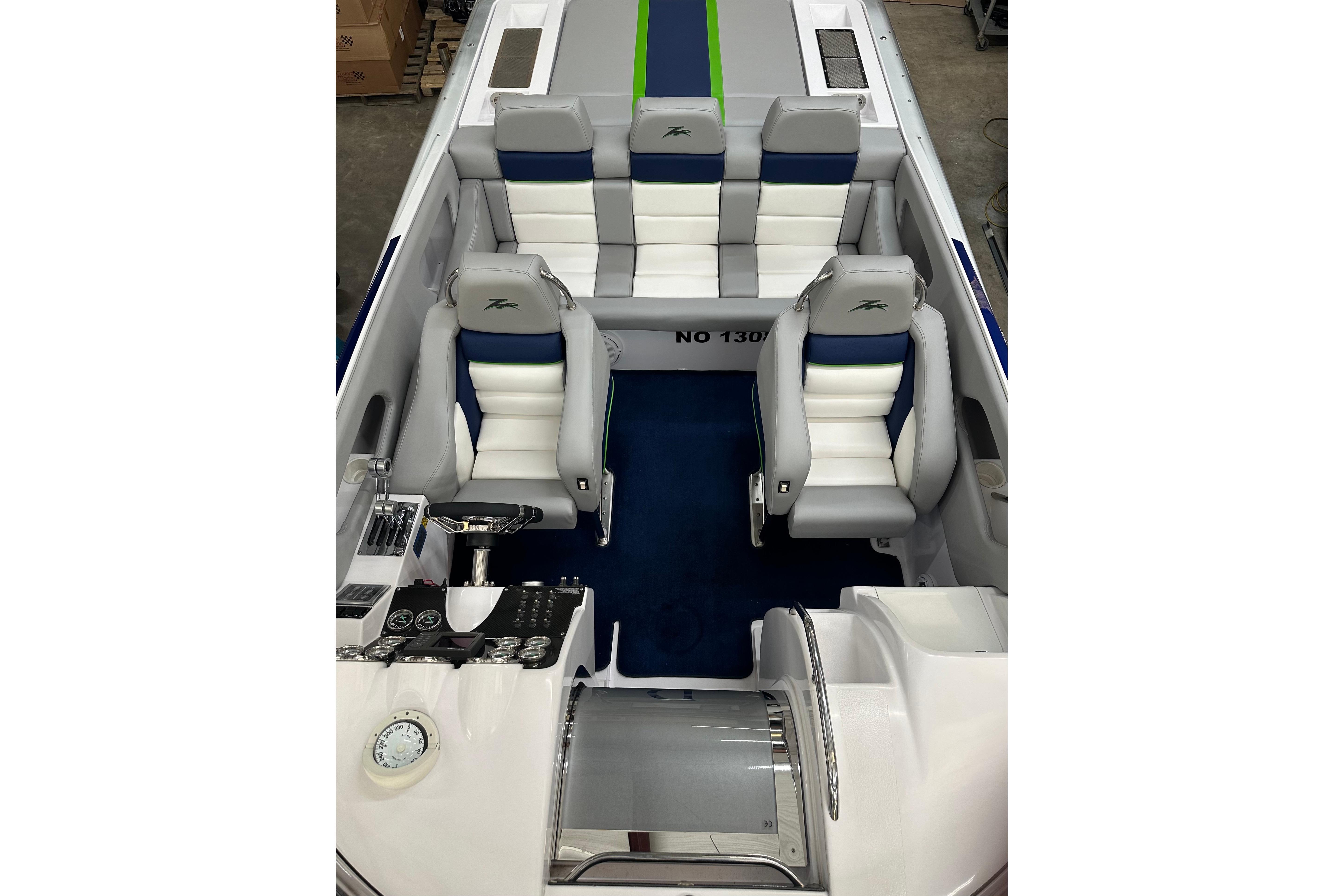 2007 Donzi 35 ZR boat interior with white and blue seating, sleek design.