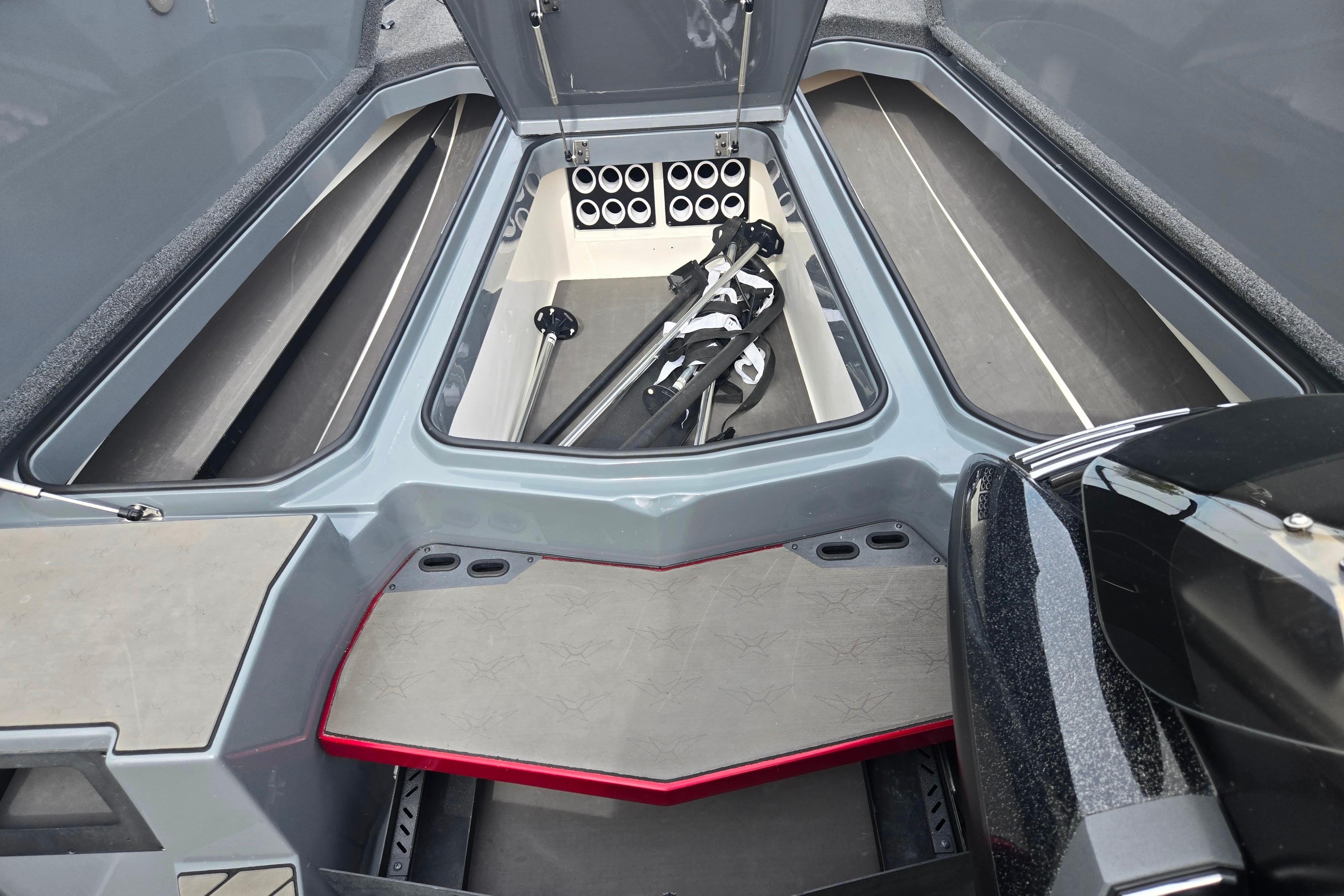 2022 Vexus VX20 boat storage compartment with organized rod holders and equipment.