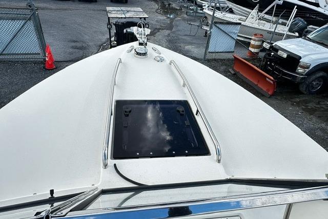 2022 Rossiter R23 Picnic Boat deck view with hatch and railing.