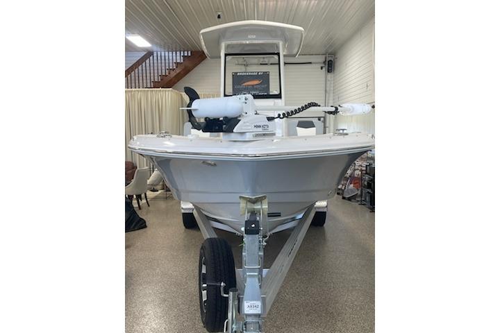2024 Robalo 246 Cayman boat displayed indoors on a trailer.