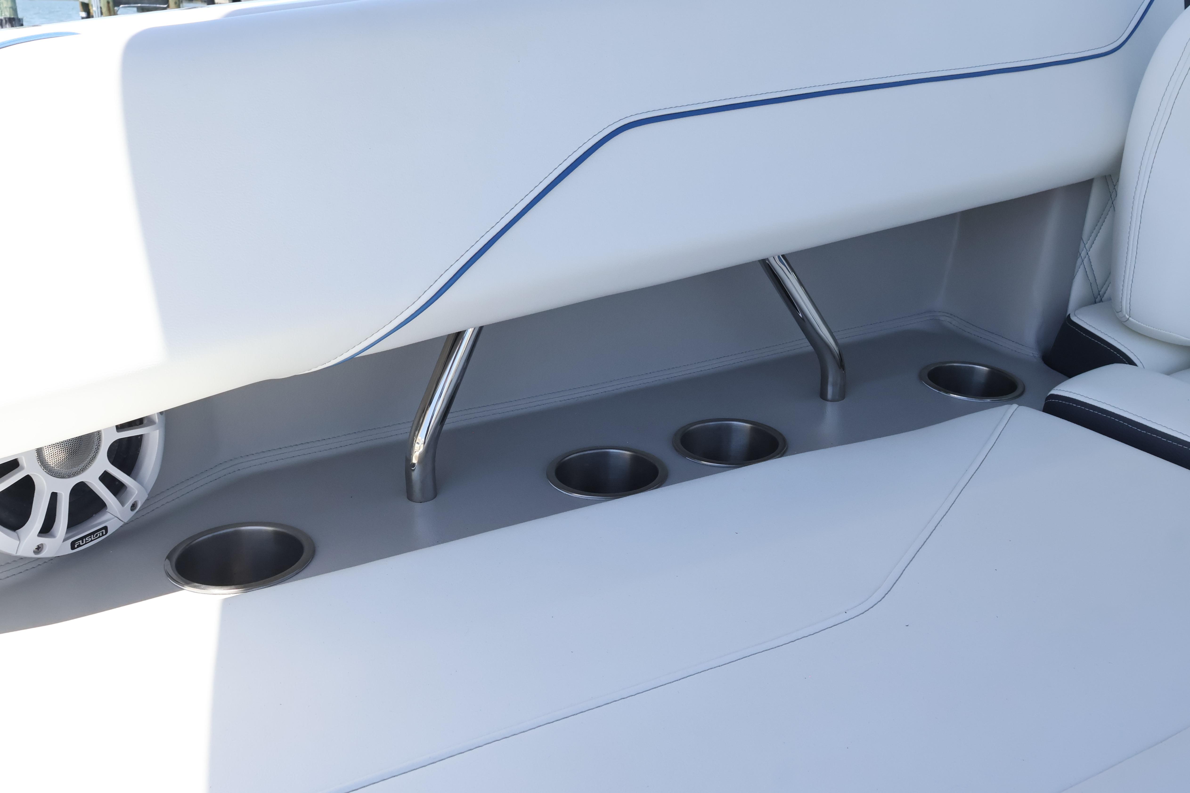 2020 Regal LX4 boat interior with cup holders and speaker.