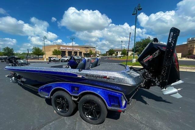 2026 Ranger Z521 boat with sleek design, parked near a boat service center under a blue sky.
