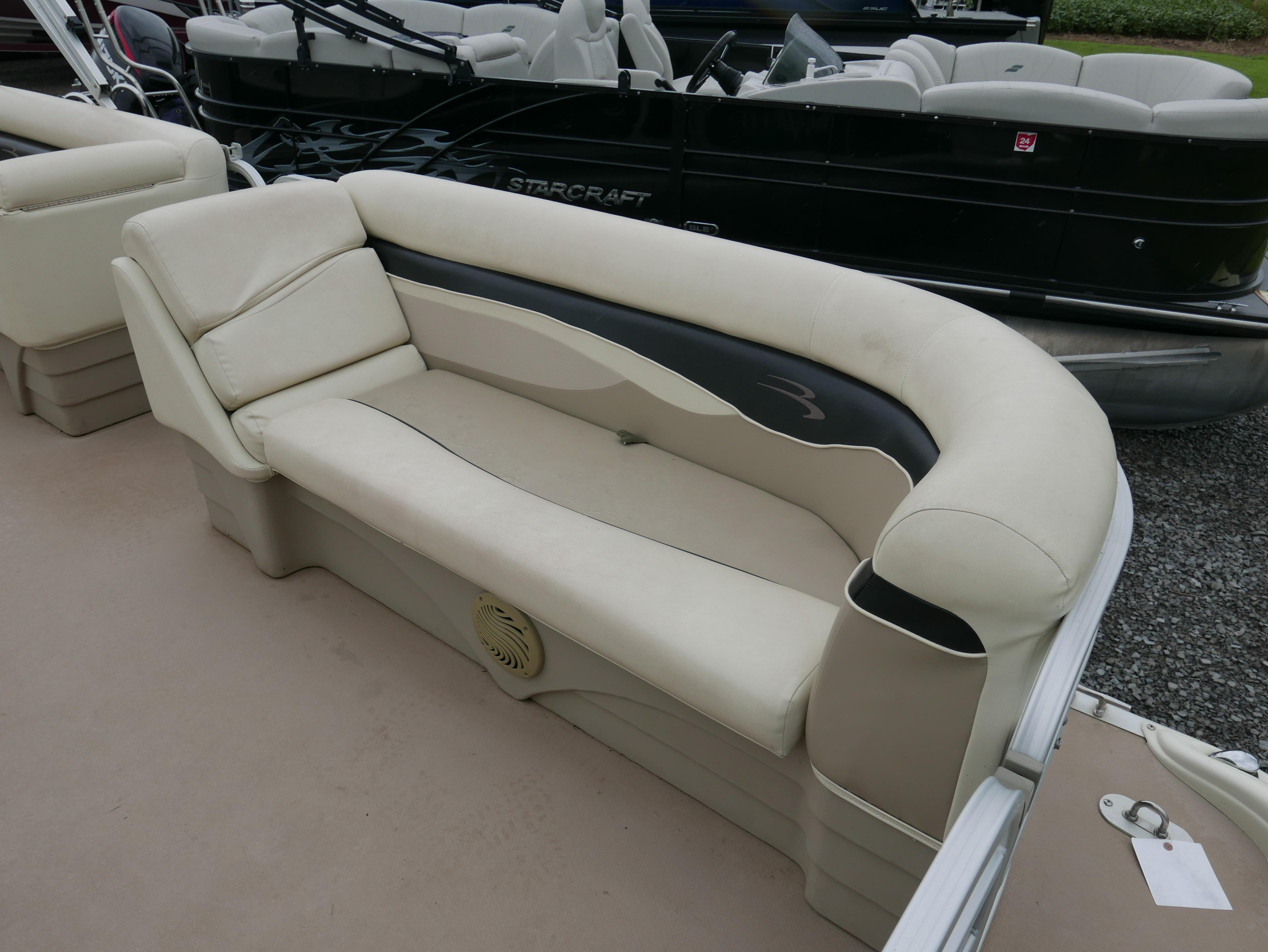 2013 Bennington 22SLX boat interior with beige seating and black accents.