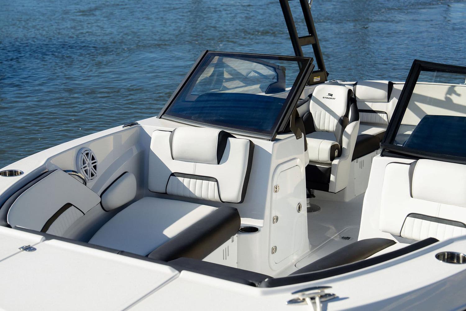 Manufacturer Provided Image: 2026 Stingray 20 SBX boat interior with sleek seating and modern design on the water.