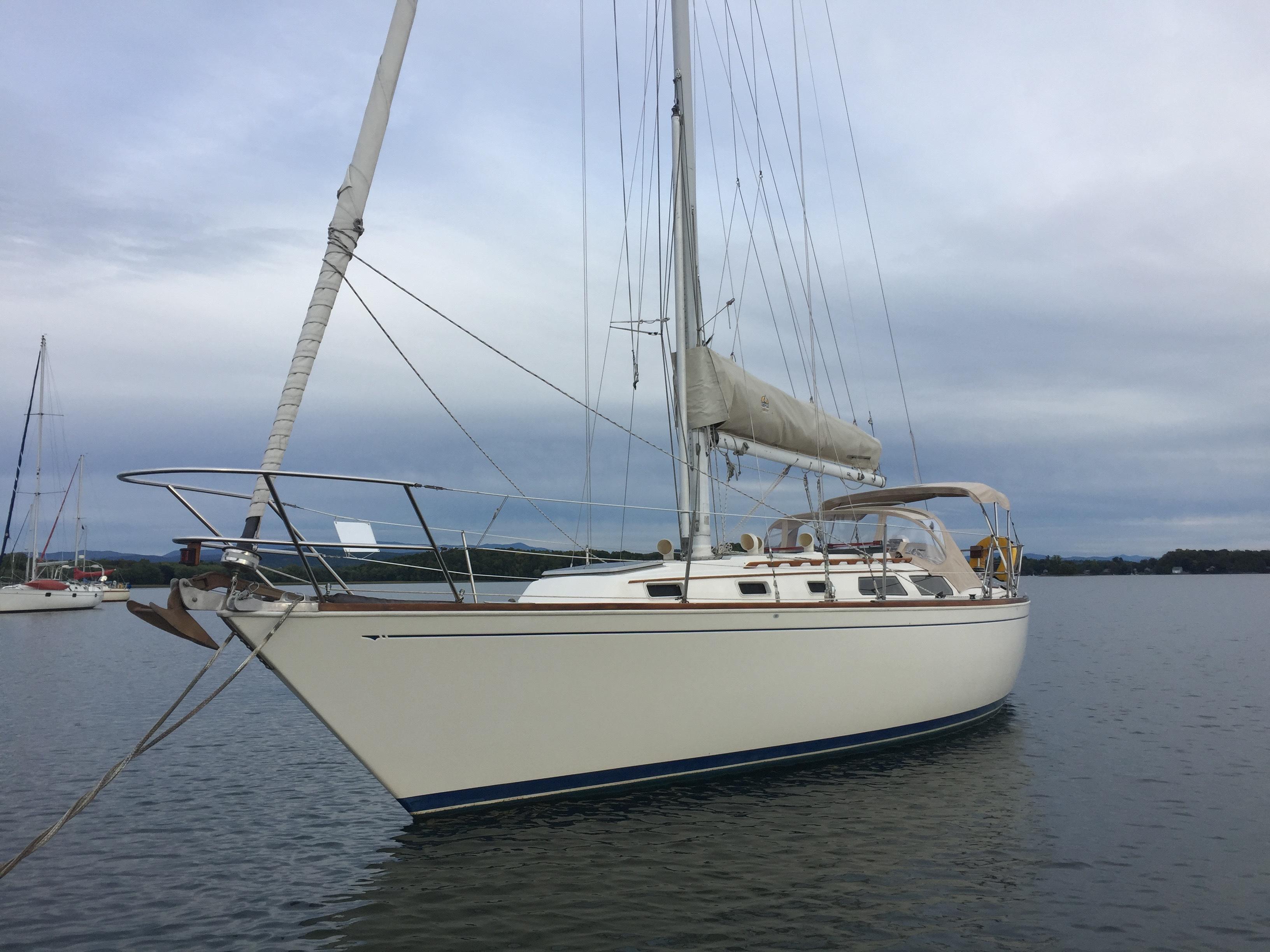 1986 Sabre 36 sailboat on calm water.