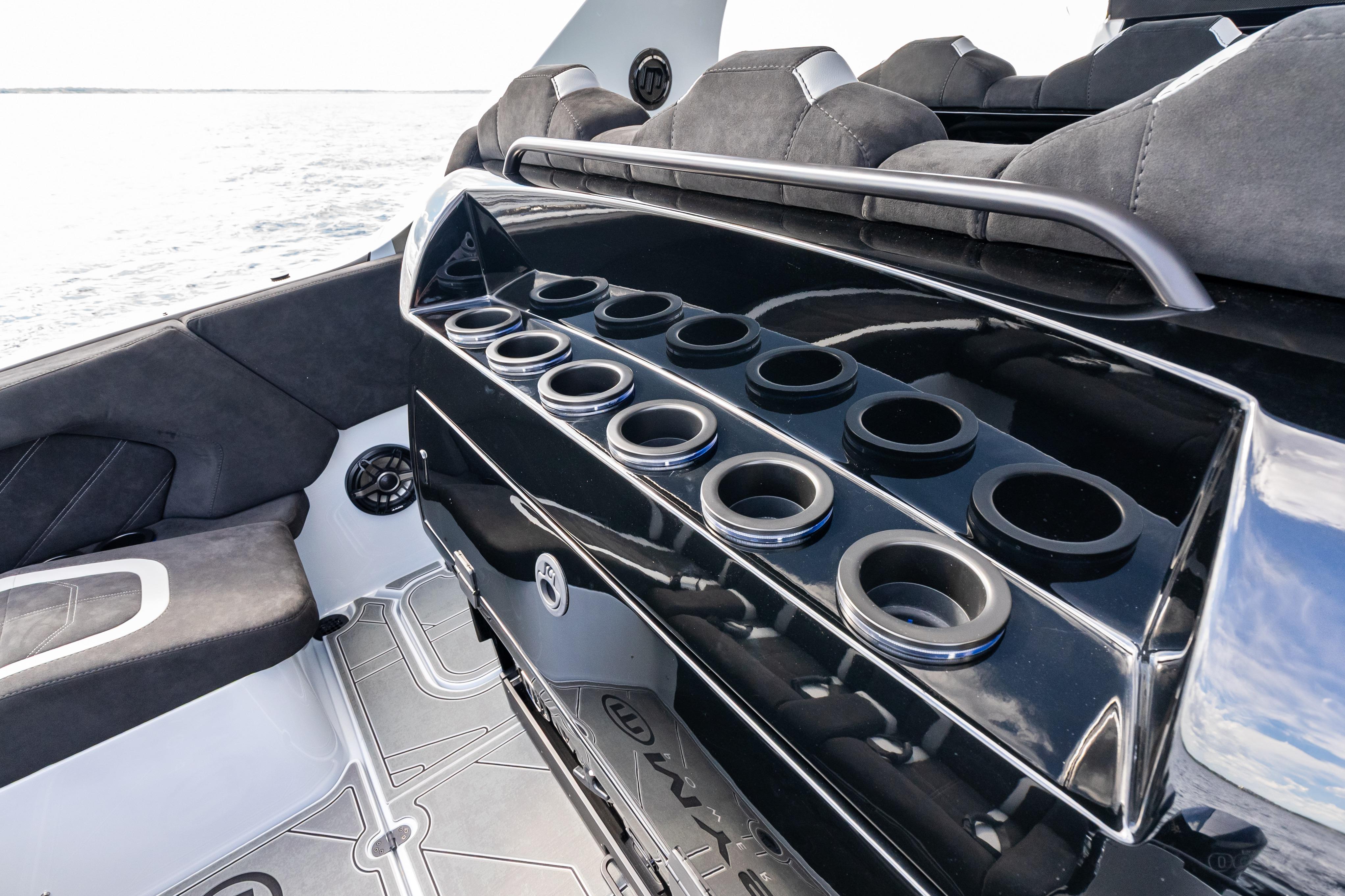 Interior of 2027 Mystic Powerboats M4200, featuring sleek seating and multiple cup holders.