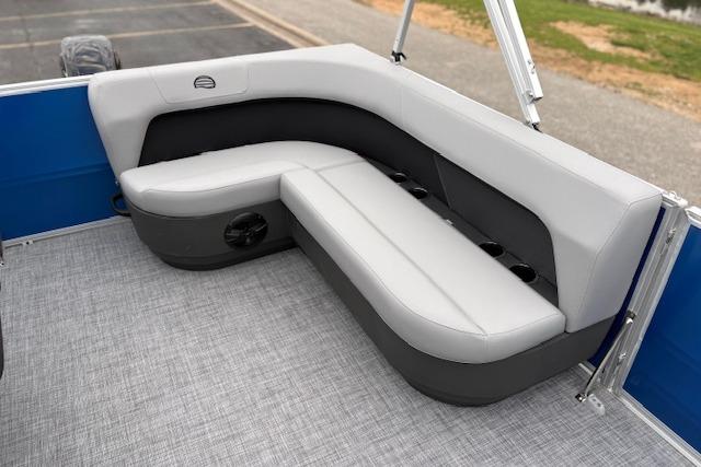 2026 Sun Tracker Party Barge 16 DLX interior seating with gray and black upholstery.