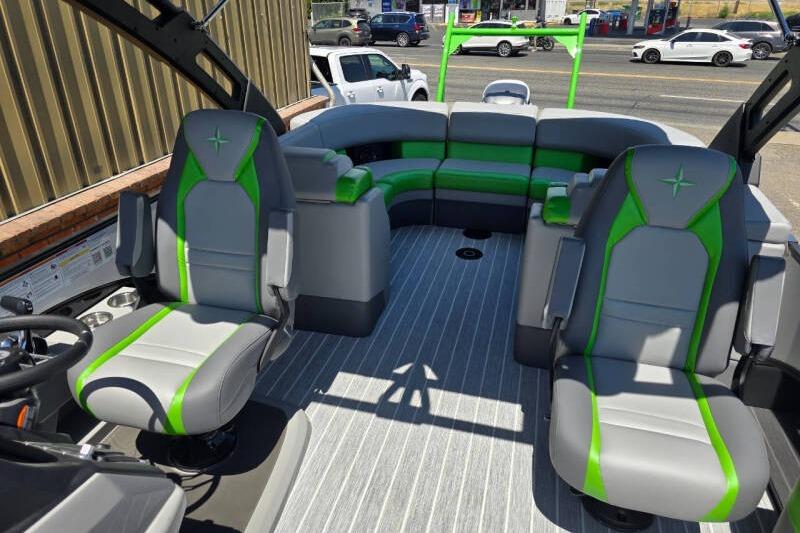 2026 Berkshire STS Arch Performance Series boat interior with gray and green seating.