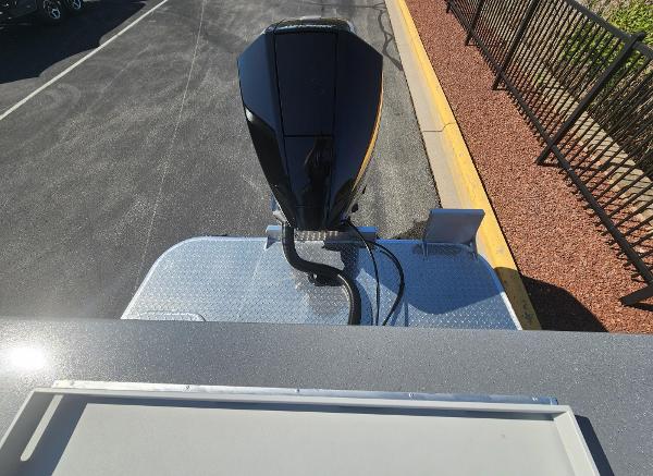 2025 Spartan 200 Astoria rooftop view with mounted equipment, parked on asphalt near a fence.