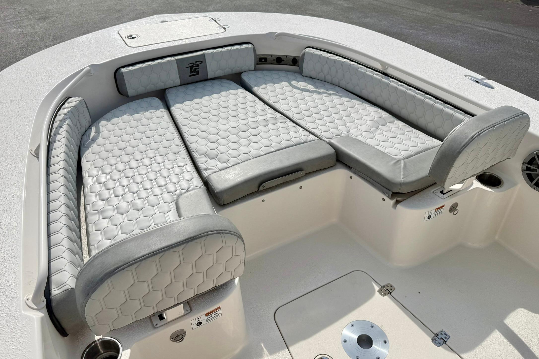 Luxurious seating on 2026 Carolina Skiff 24 Ultra Elite boat, featuring hexagonal-patterned upholstery.