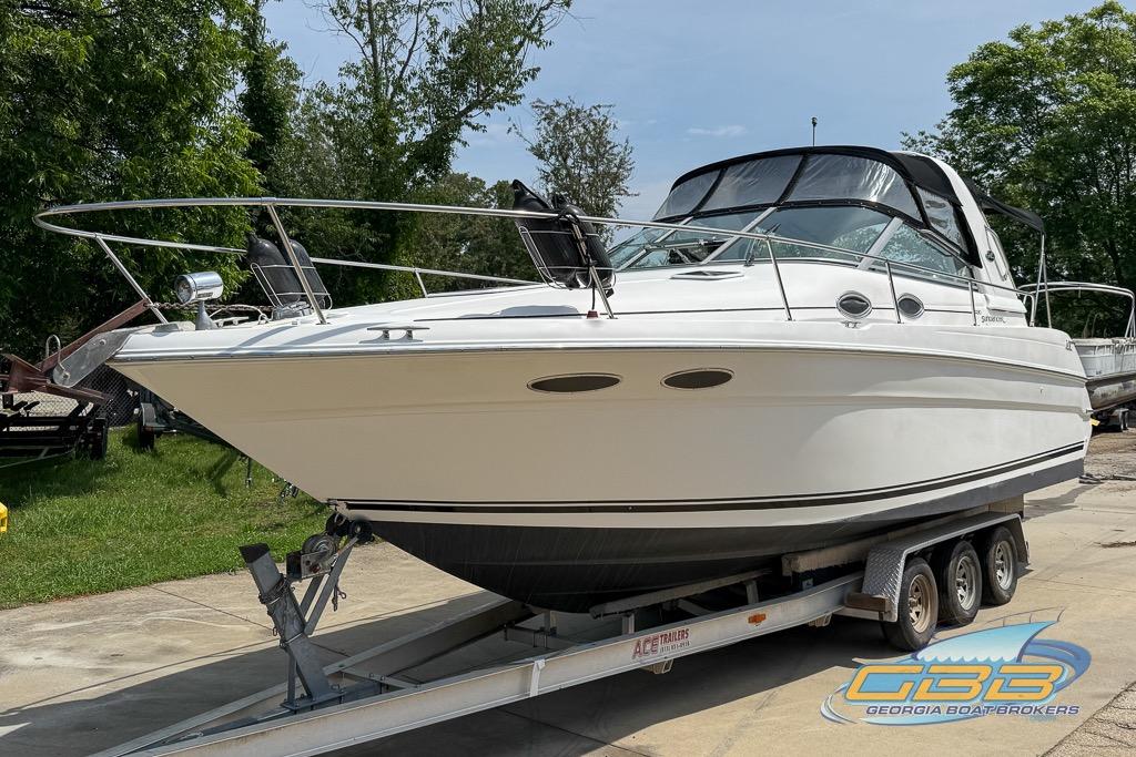 1999 Sea Ray 290 Sundancer boat on trailer, displayed outdoors at Georgia Boat Brokers.