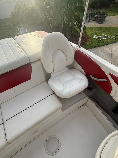 Interior of a 2012 Bayliner 184 SF boat with white seating.