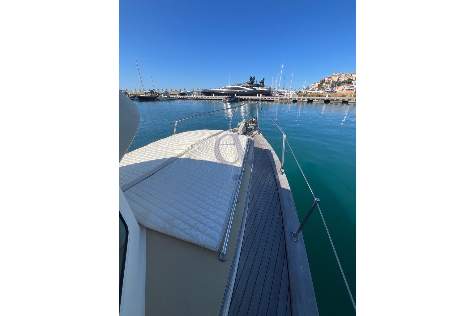 Luxury yacht deck view, Sibma Navale Italiana Armstrong 12, 2012 model, docked in marina.