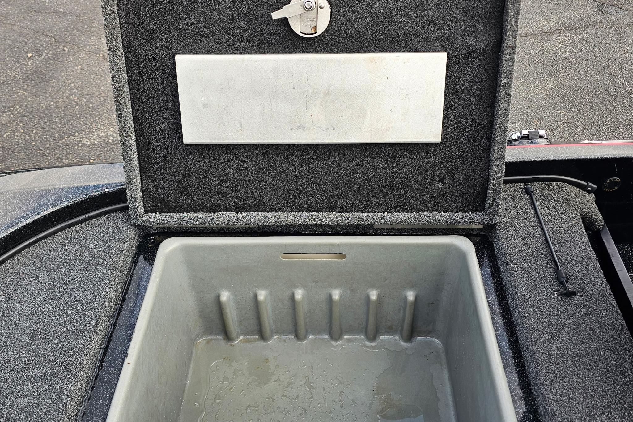 Open storage compartment in a 2017 Nitro Z20 Pro boat.