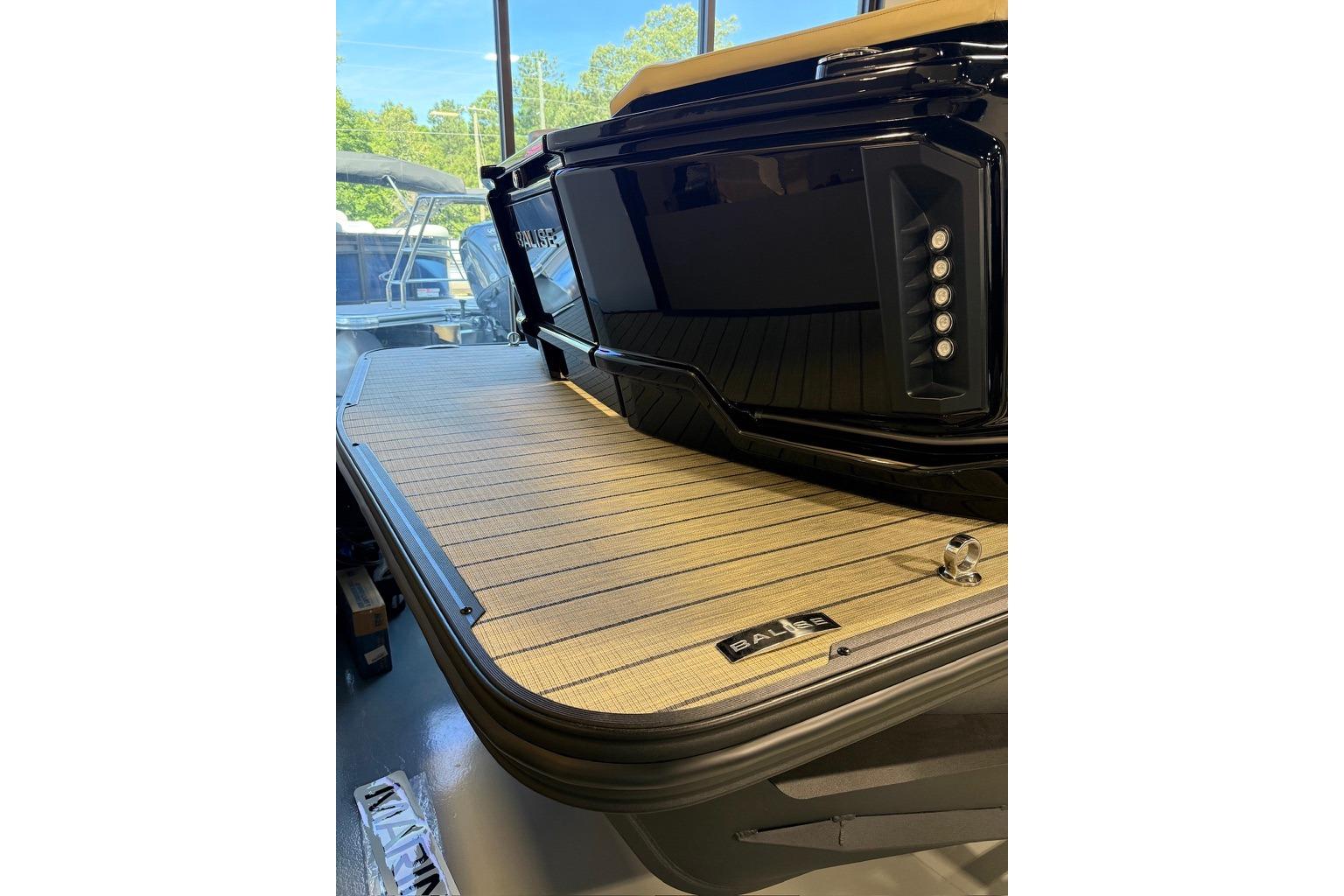 2026 Balise Halo 26C Twin boat with sleek black design and wooden deck.