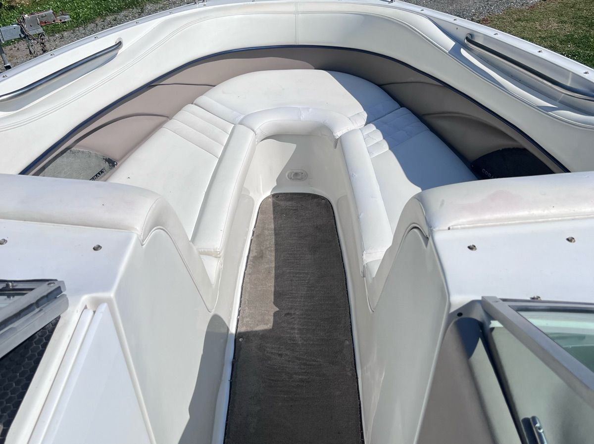 Interior of a 2003 Cobalt Colbalt 262 boat with white seating.