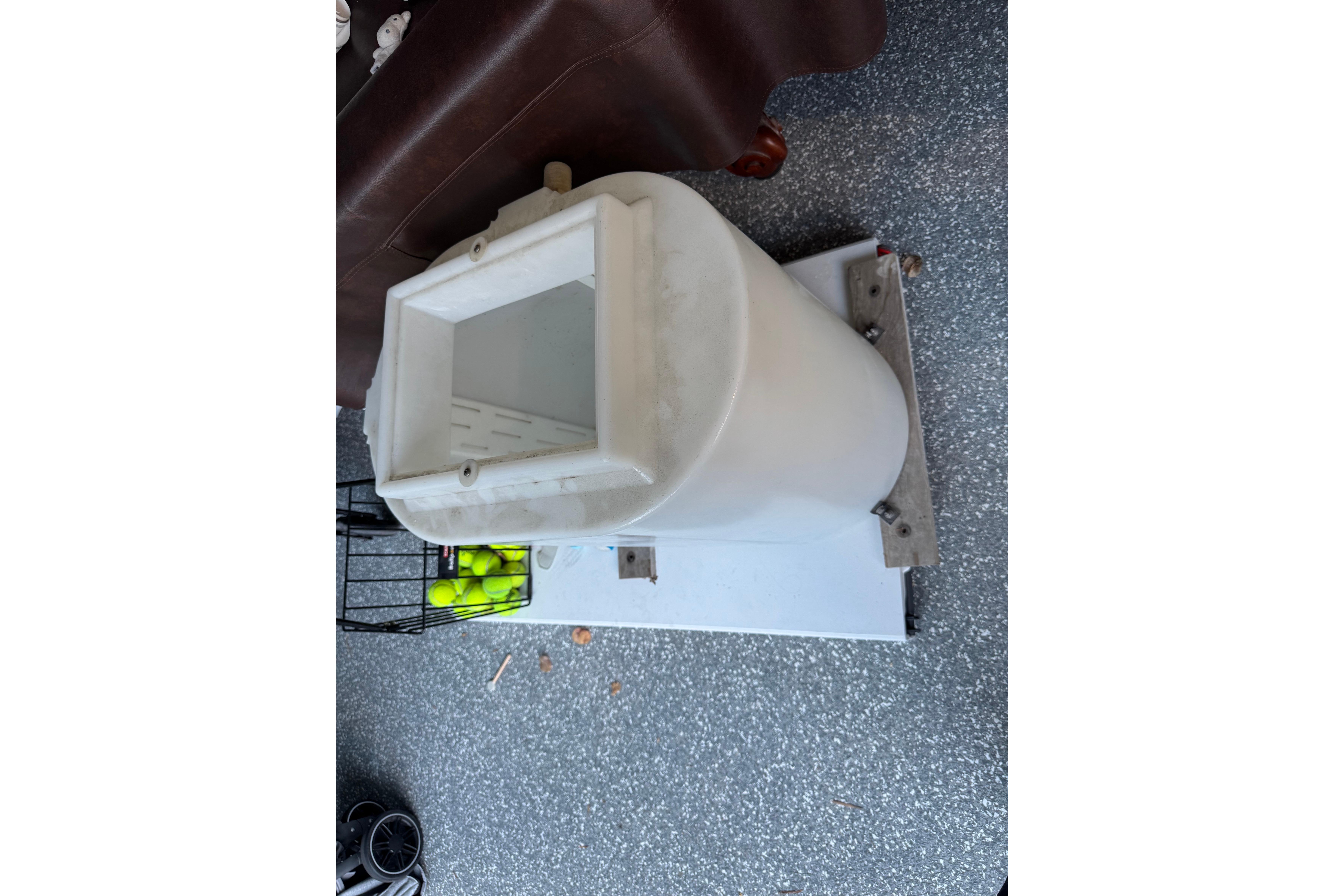 White marine equipment on a Tiara Yachts 2900 Open, 1995 model, with tennis balls nearby.