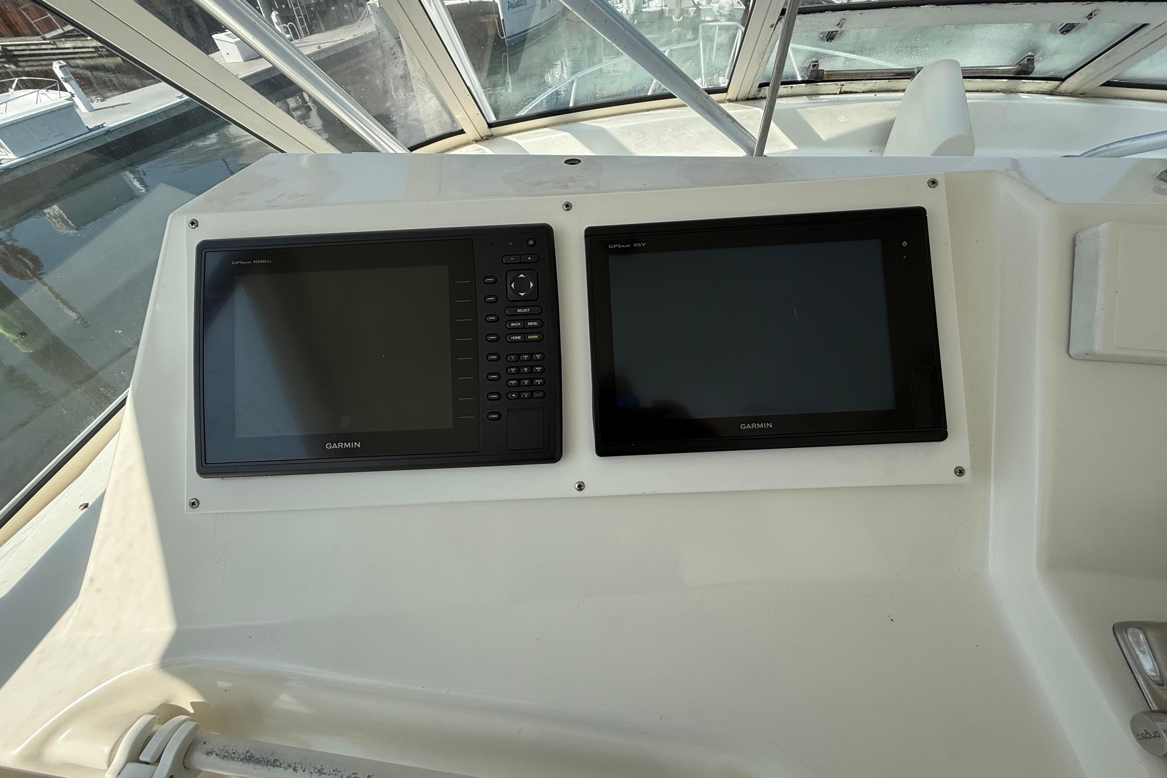 Garmin navigation displays on 1999 Ocean Yachts 40 Express boat dashboard.