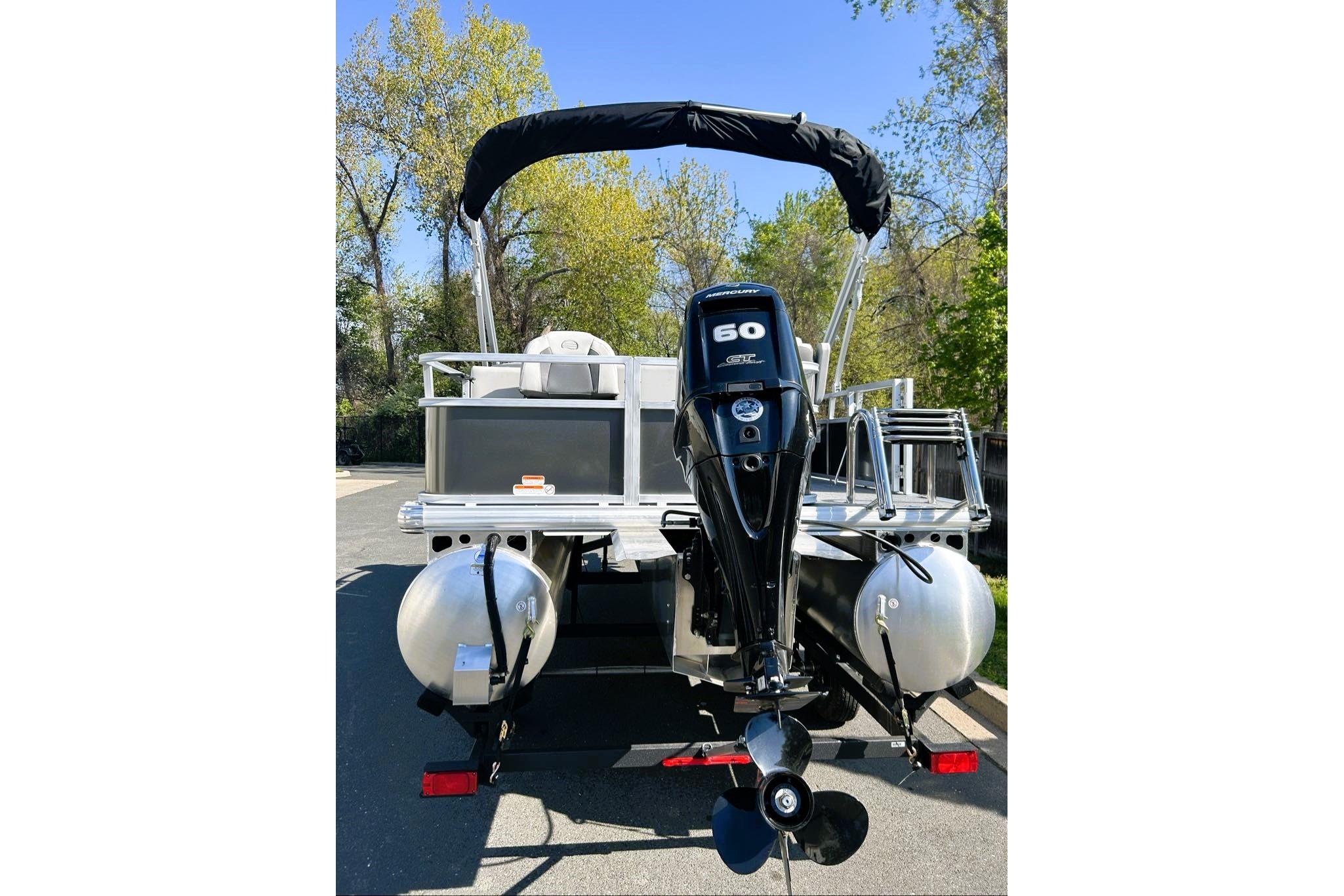 2026 Sun Tracker Bass Buggy 18 DLX pontoon boat with 60 HP Mercury engine.