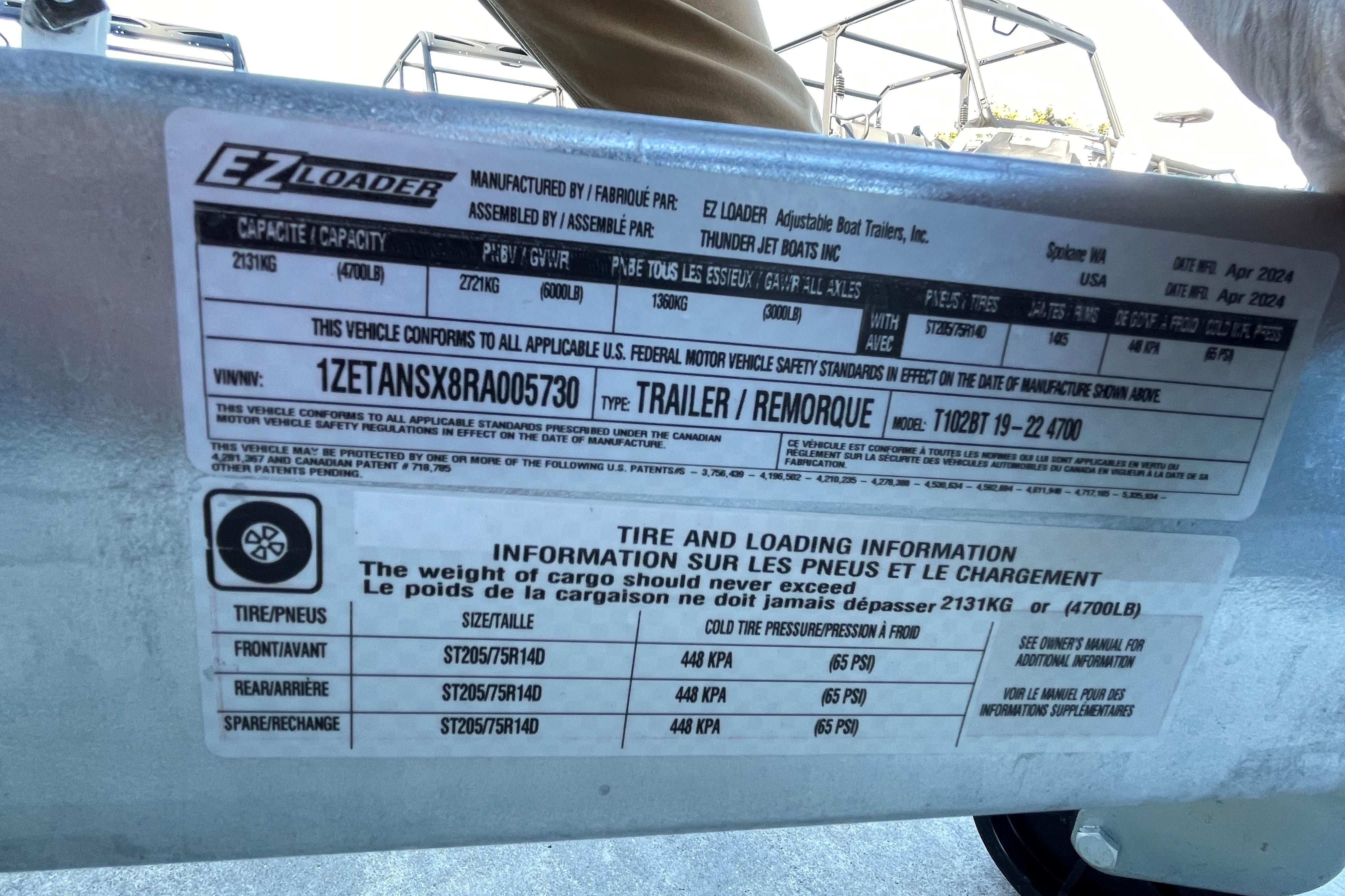 Spartan 200 Astoria 2025 trailer label with tire and loading information, capacity details.