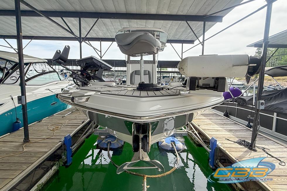 2022 NauticStar 251 Hybrid boat docked, featuring modern design and equipment.