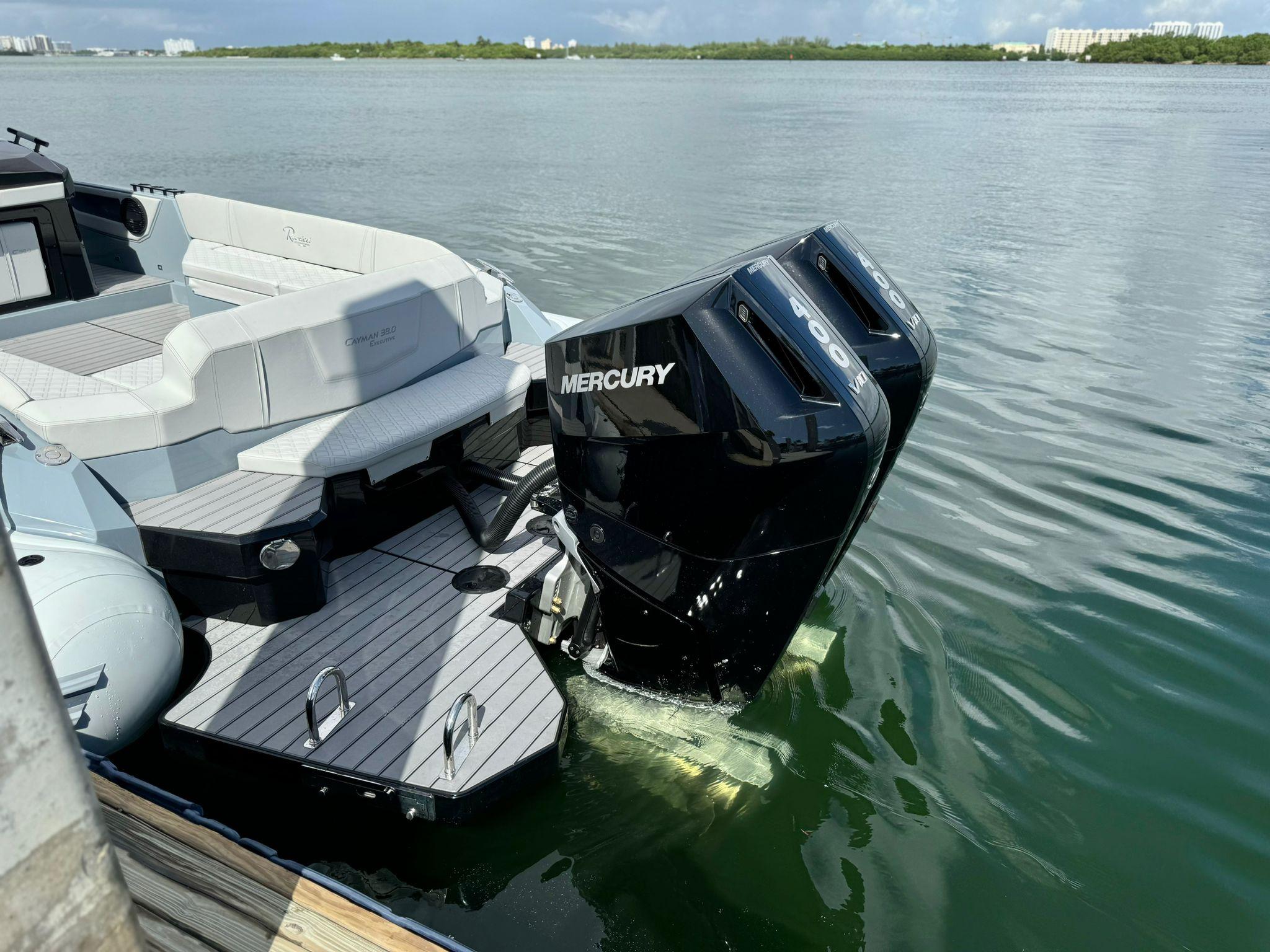 2025 Ranieri CAYMAN 38.0 EXECUTIVE with dual Mercury outboard engines on water.