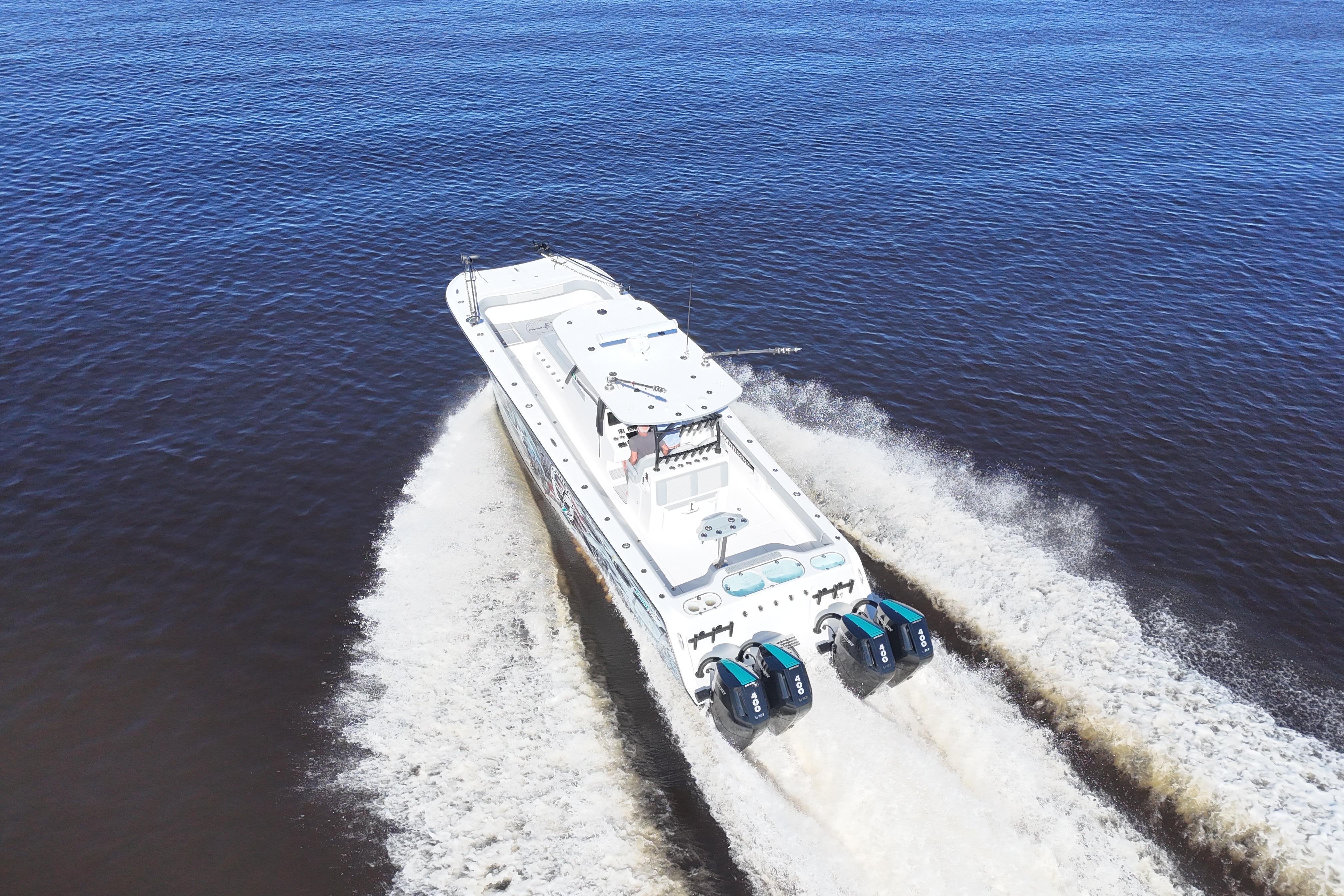 2024 Front Runner 37 Catamaran cruising on open water, aerial view.