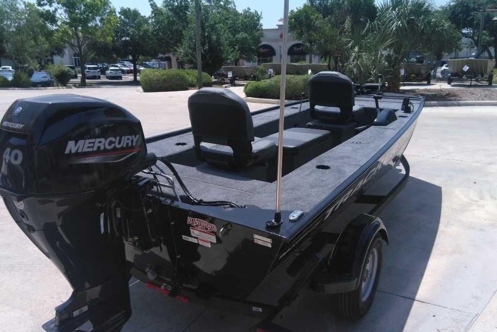 2025 Tracker Panfish 17 boat with Mercury 40 engine, parked outdoors.