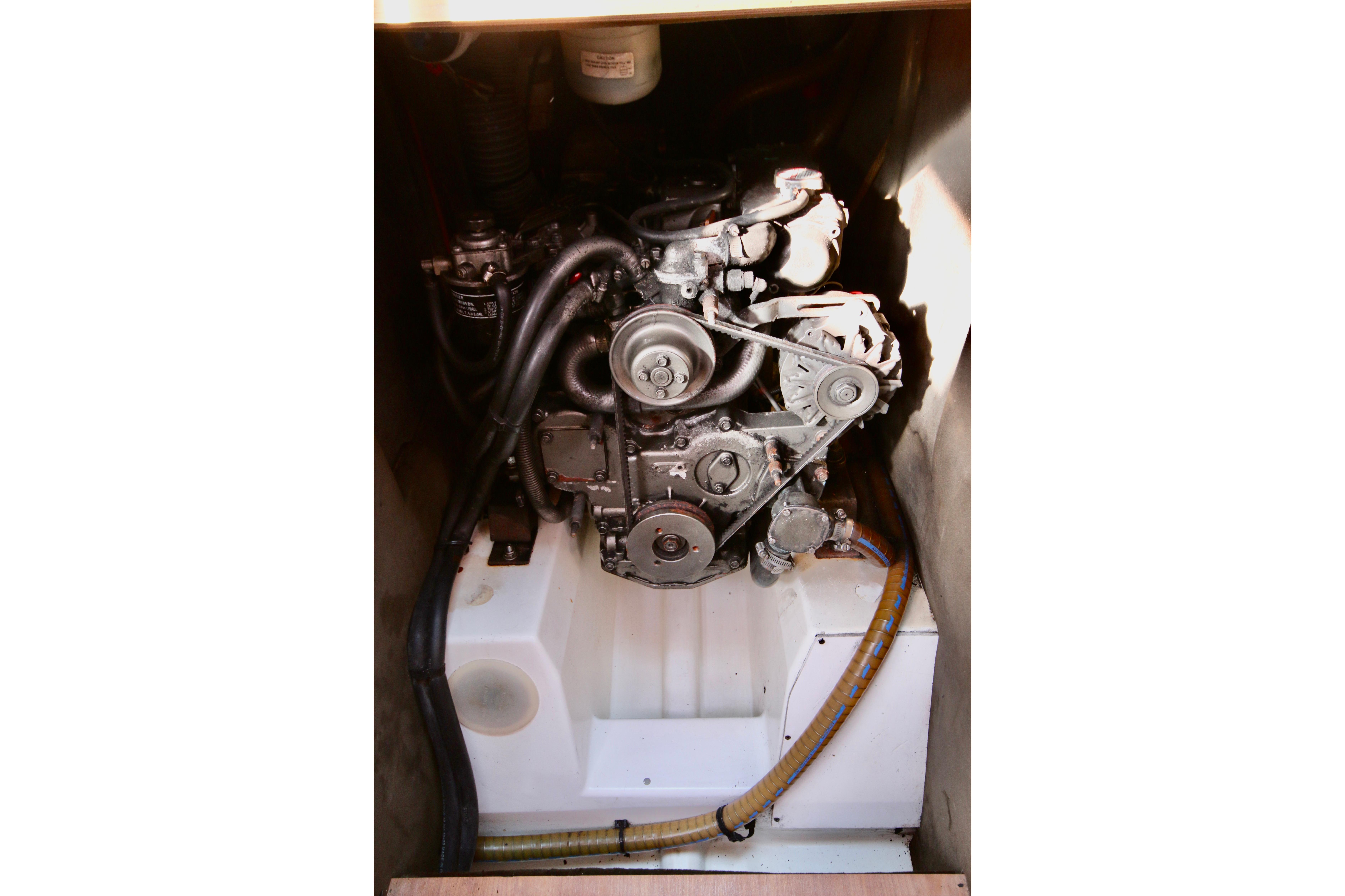 Engine compartment of a 2009 Jeanneau Sun Odyssey 44i sailboat, showcasing mechanical components.