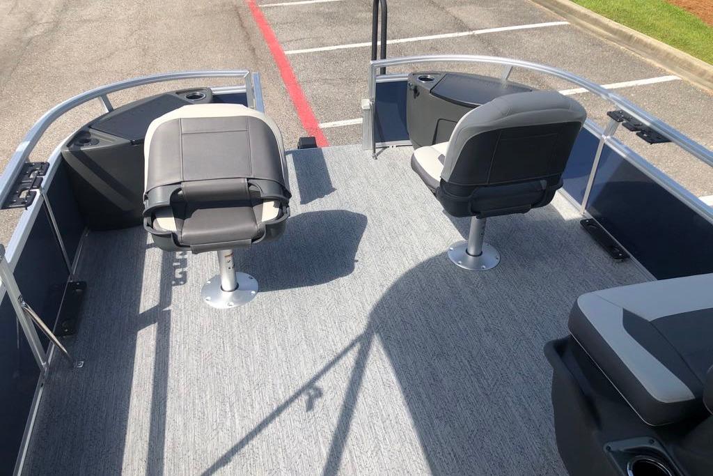 2026 Sun Tracker Bass Buggy 18 DLX pontoon boat interior with seating and carpeted deck.