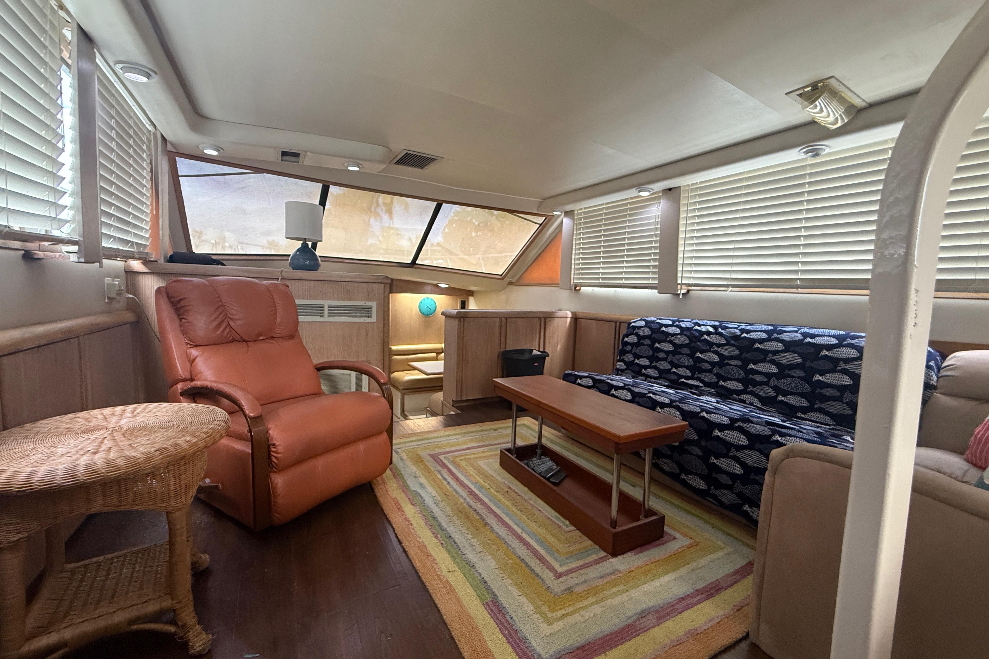 Interior of 1991 Californian 55 Cockpit Motor Yacht with cozy seating and natural light.